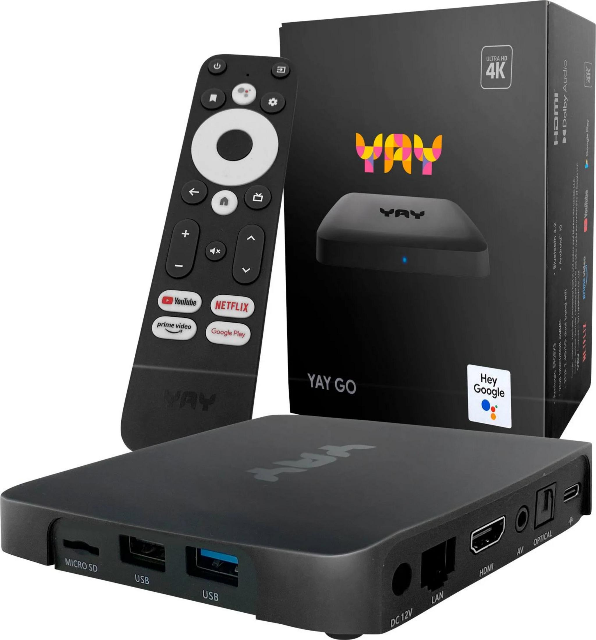 Ein schwarzer TV-Receiver mit Fernbedienung und Verpackung. Mit Anschlüssen.