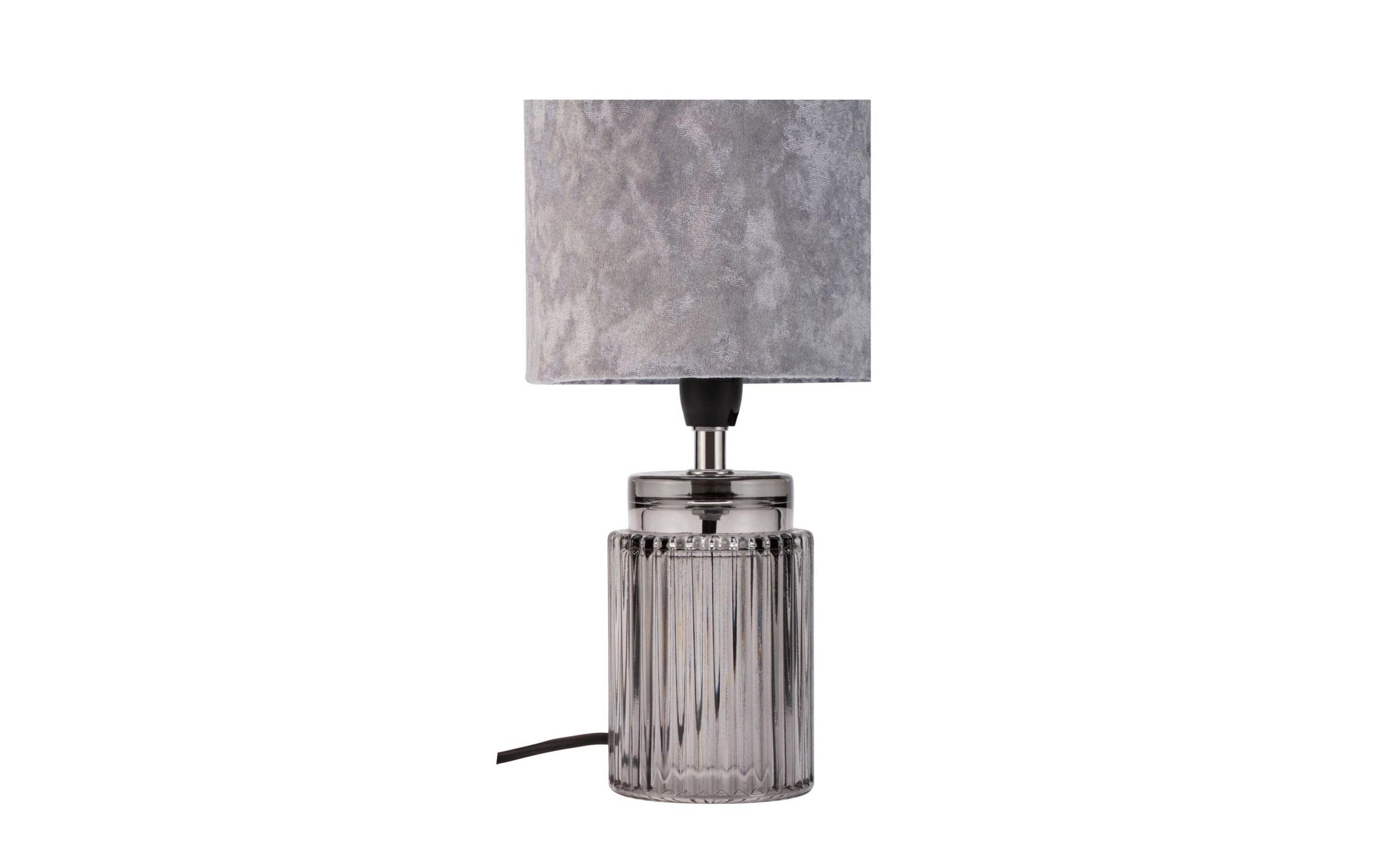 Eine graue Lampe mit einem zylindrischen Lampenschirm und einem gerippten Glasfuß.