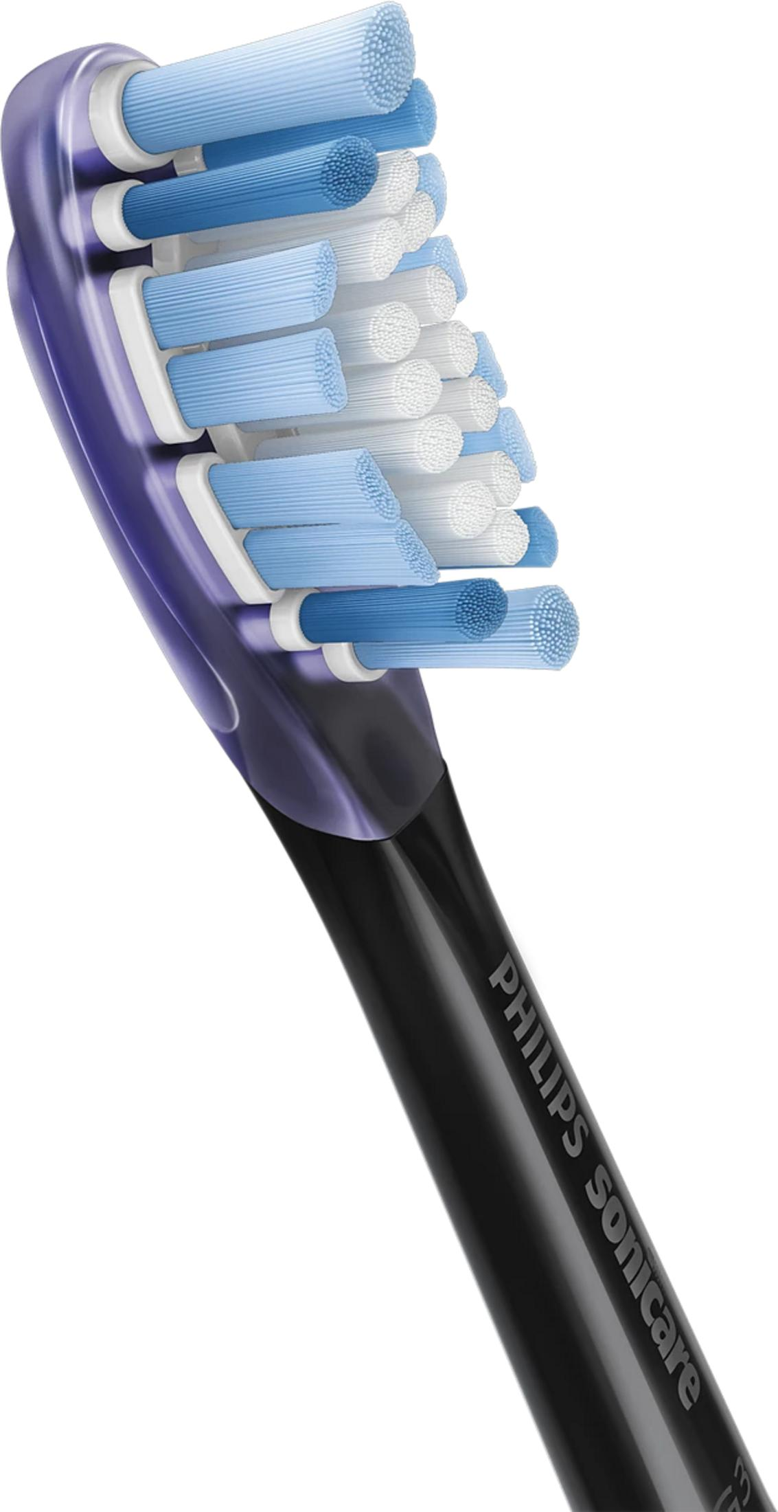 Primer plano de un cabezal de cepillo azul y blanco con mango negro.
