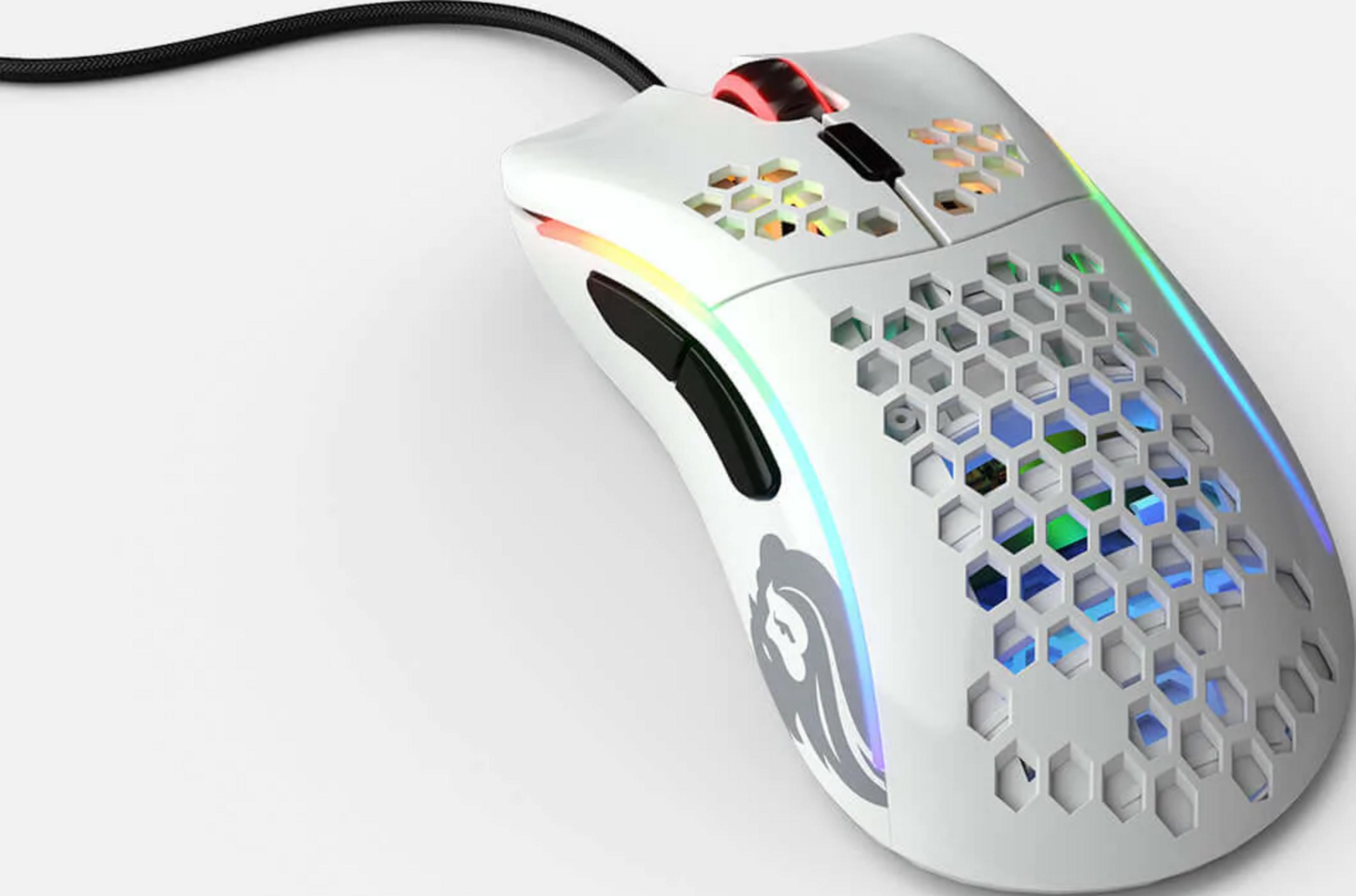 A white gaming mouse with honeycomb design and RGB lighting.