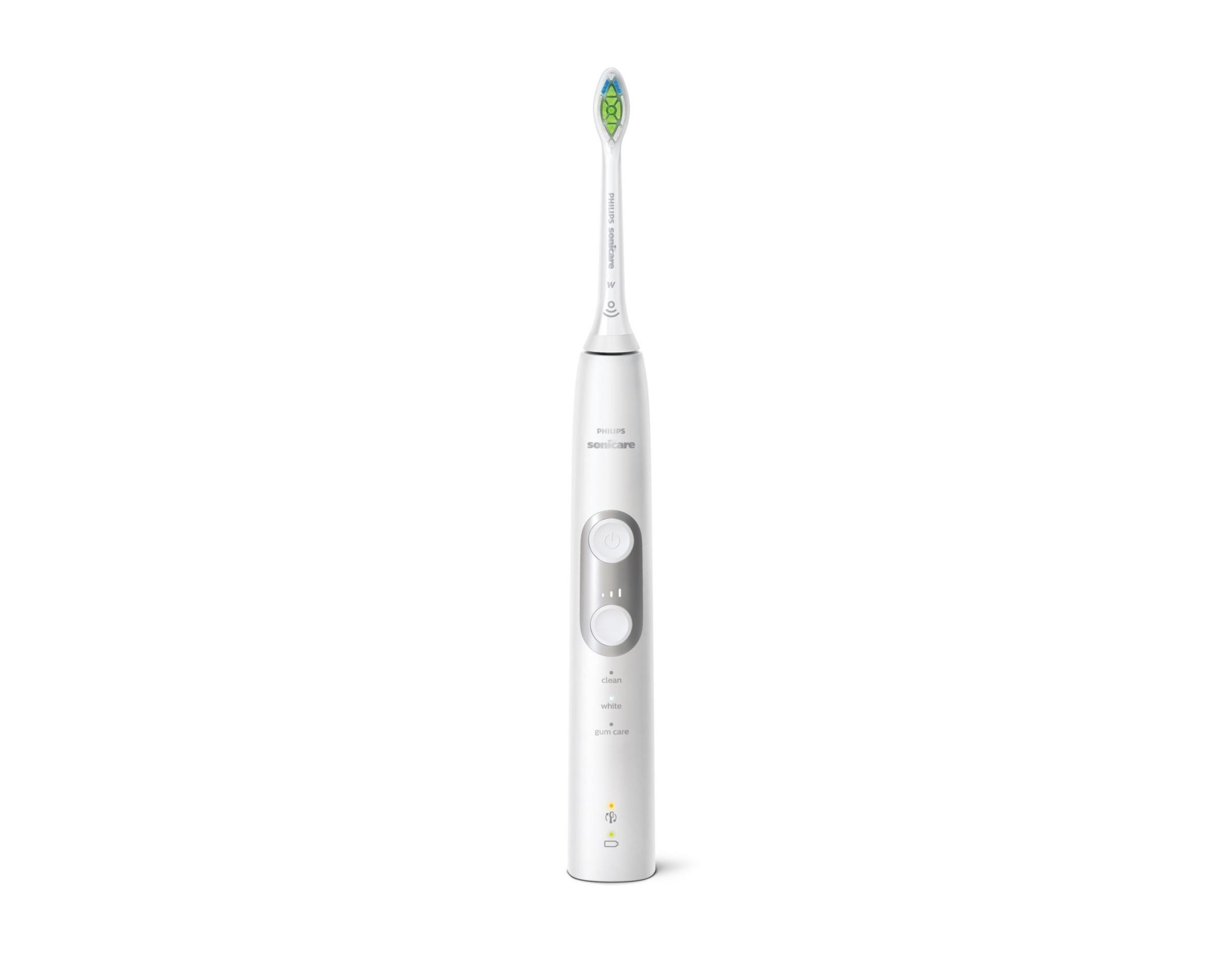 Uno spazzolino elettrico bianco Philips Sonicare con testina verde.