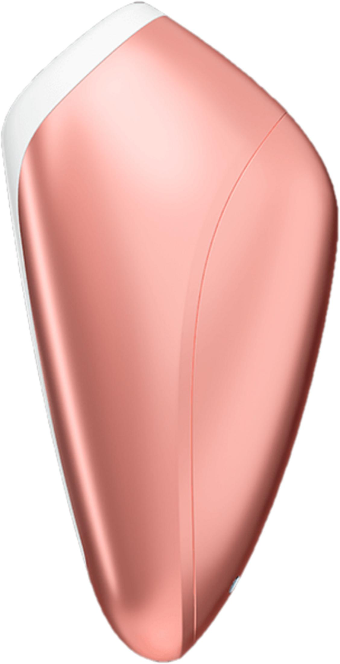 Un dispositivo con forma de lágrima, color oro rosa, con parte superior blanca y una costura.