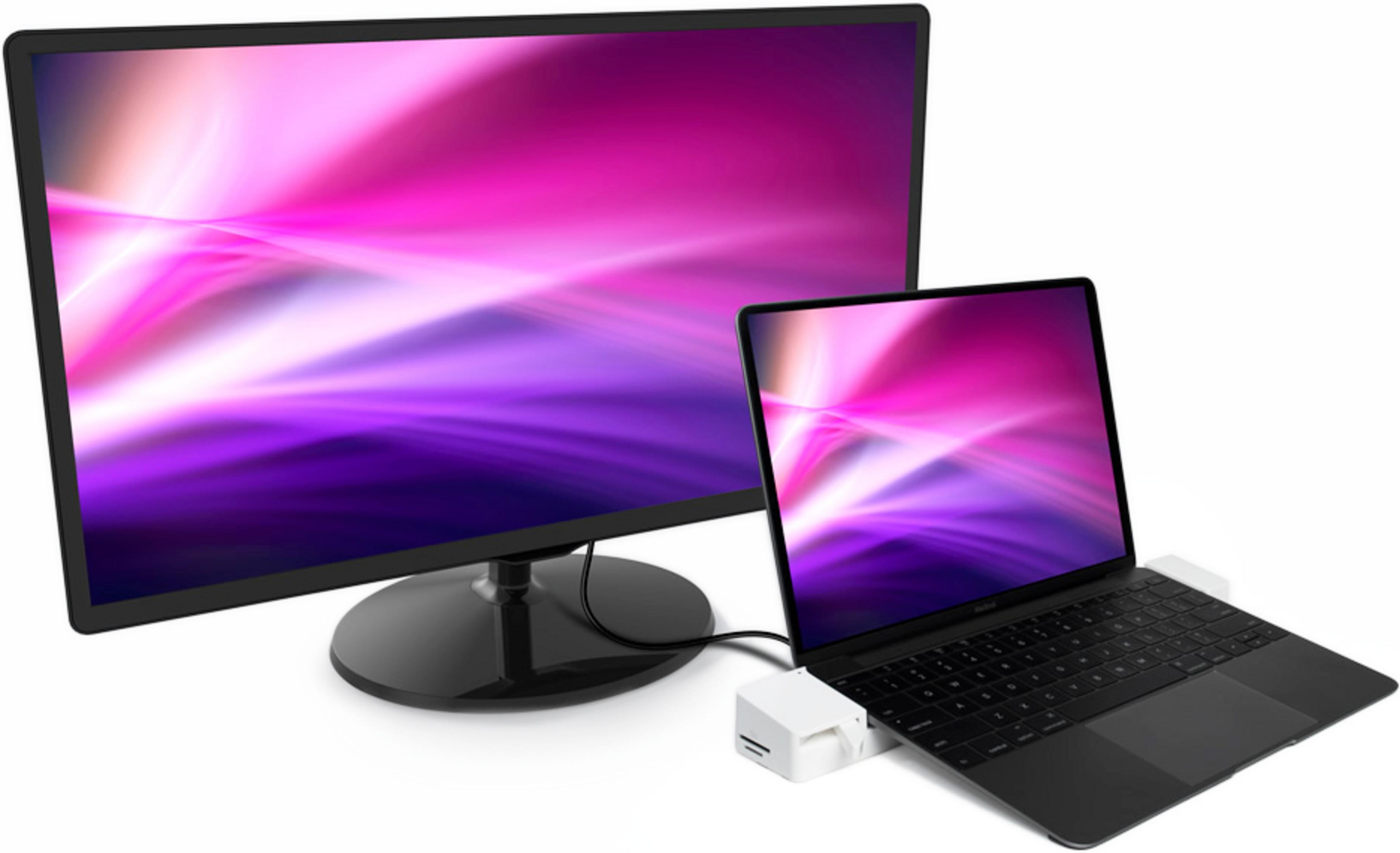 Ein Laptop ist an ein Dock angeschlossen, das vor einem großen Monitor steht.