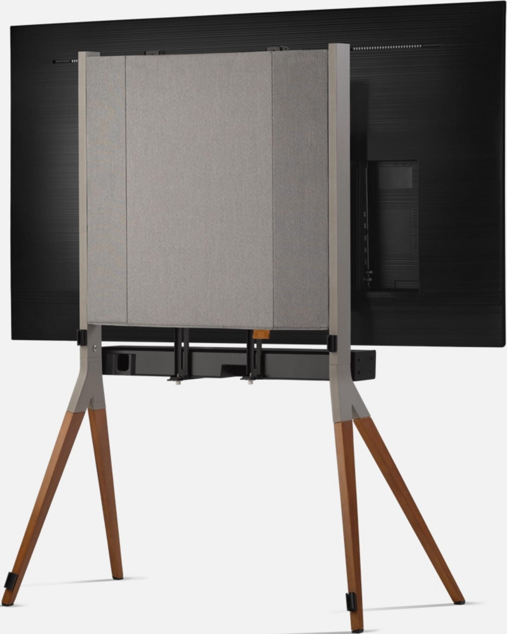 Rückseite eines Fernsehers mit Stoffverkleidung und Holzbein-Ständer.