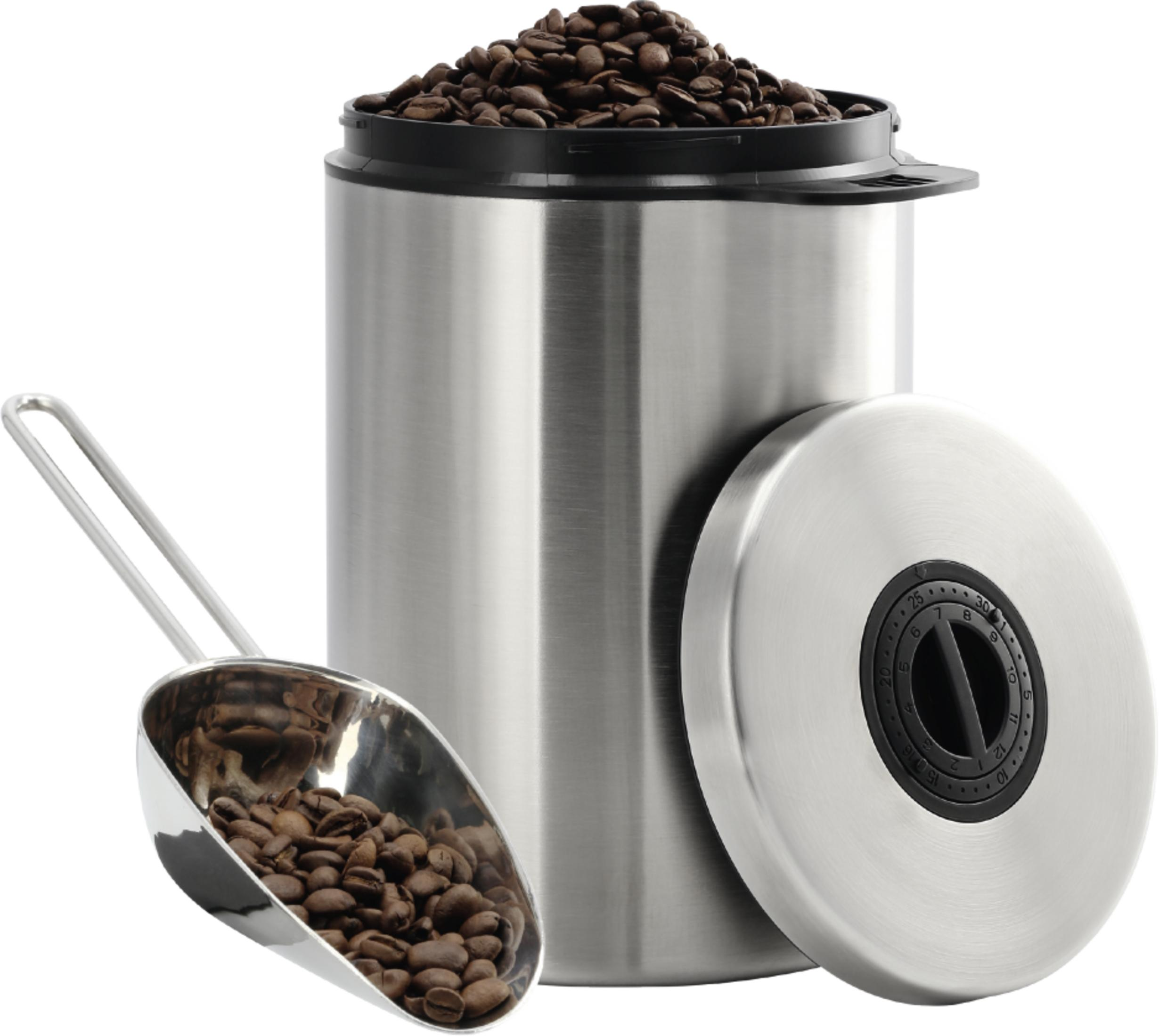 Edelstahlbehälter mit Kaffeebohnen und Löffel. Deckel daneben.