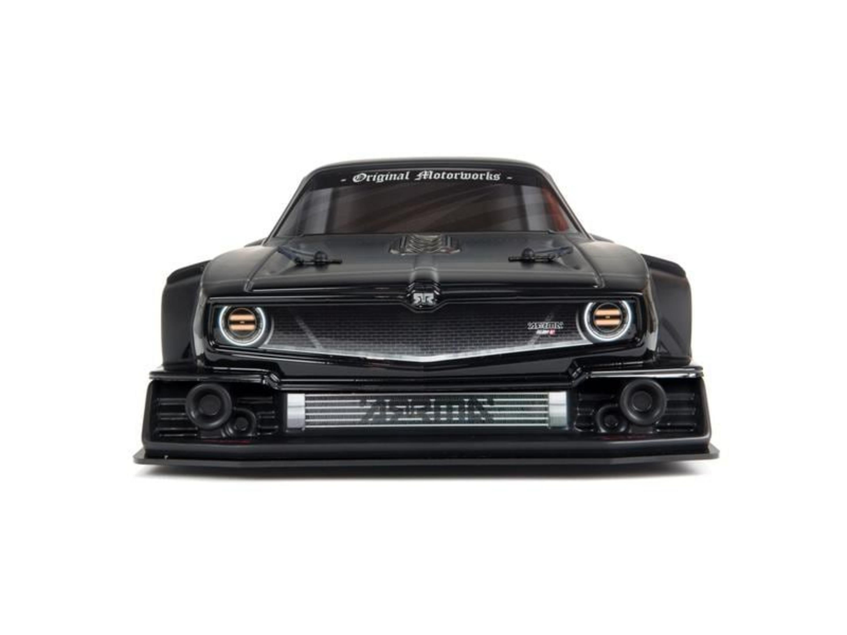 Voiture modèle noire avec calandre argentée et phares ronds.