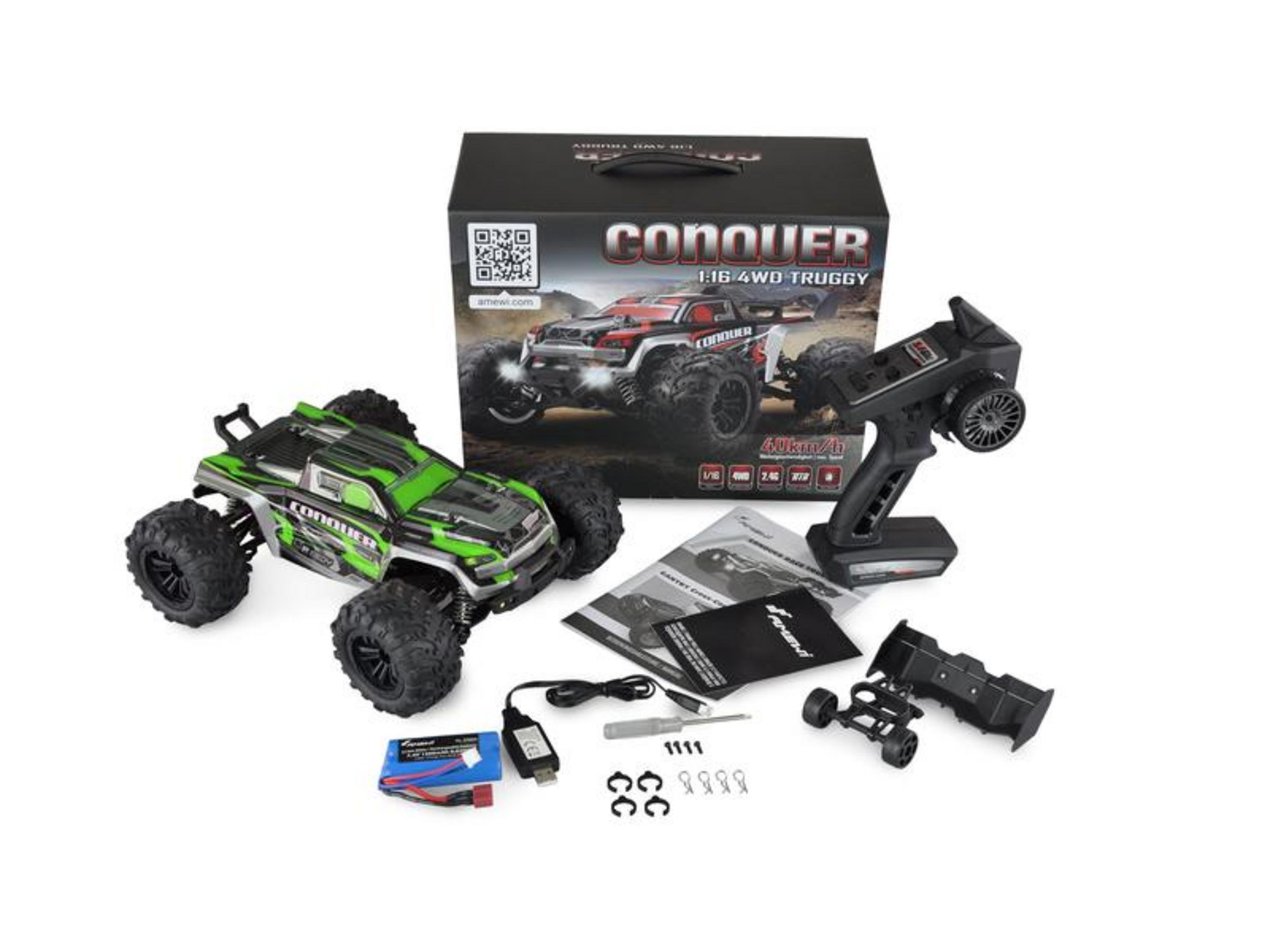 Un buggy verde y negro a control remoto con mando, caja y accesorios.