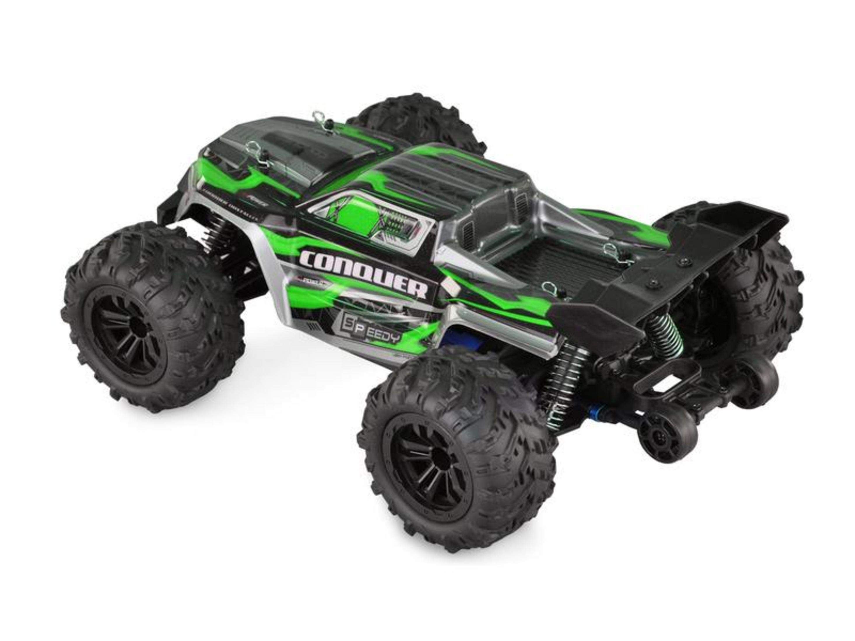 Un monster truck verde a control remoto con detalles negros y neumáticos grandes.
