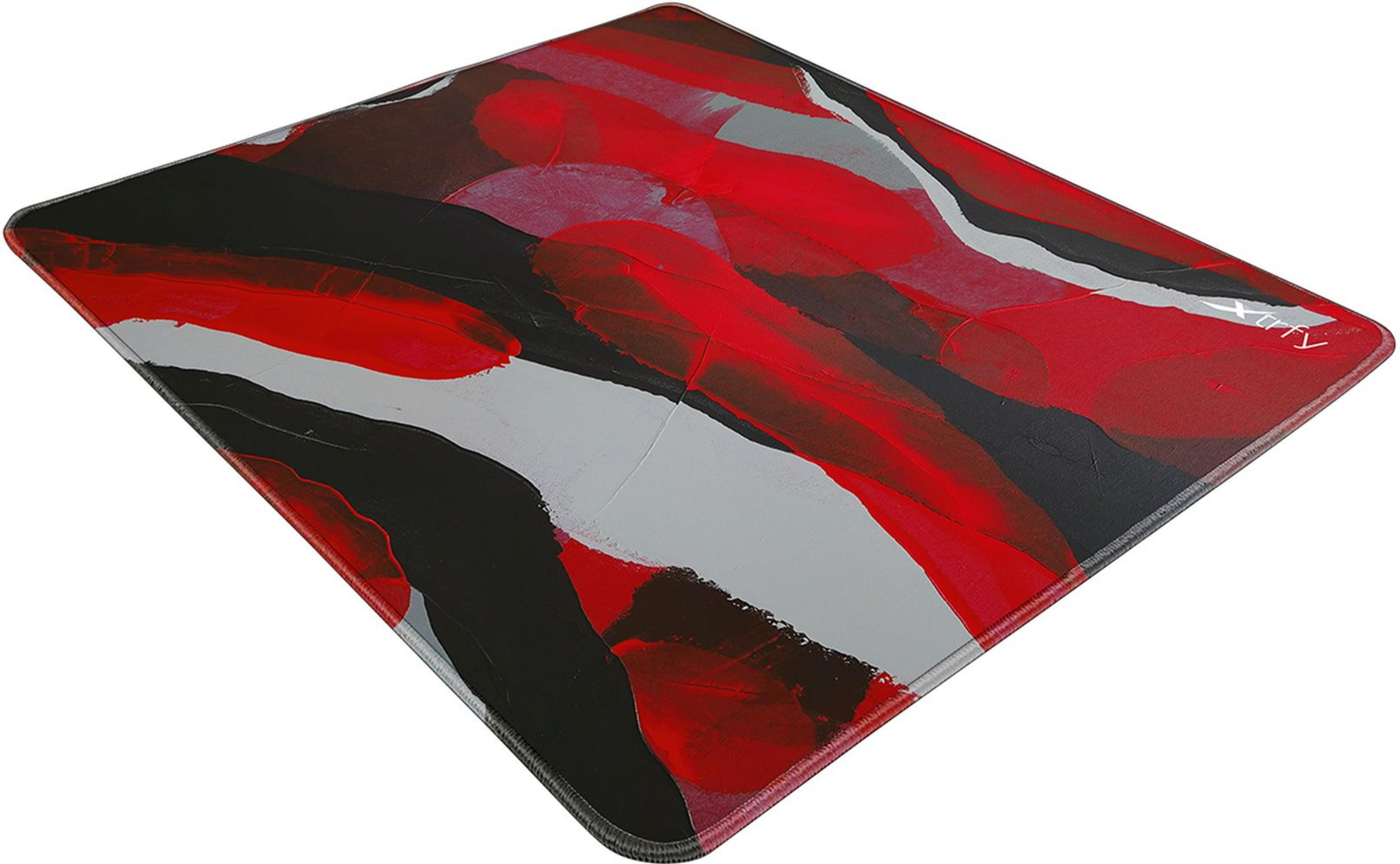 Un tapis de souris avec un motif abstrait de coups de pinceau rouges, noirs et gris.