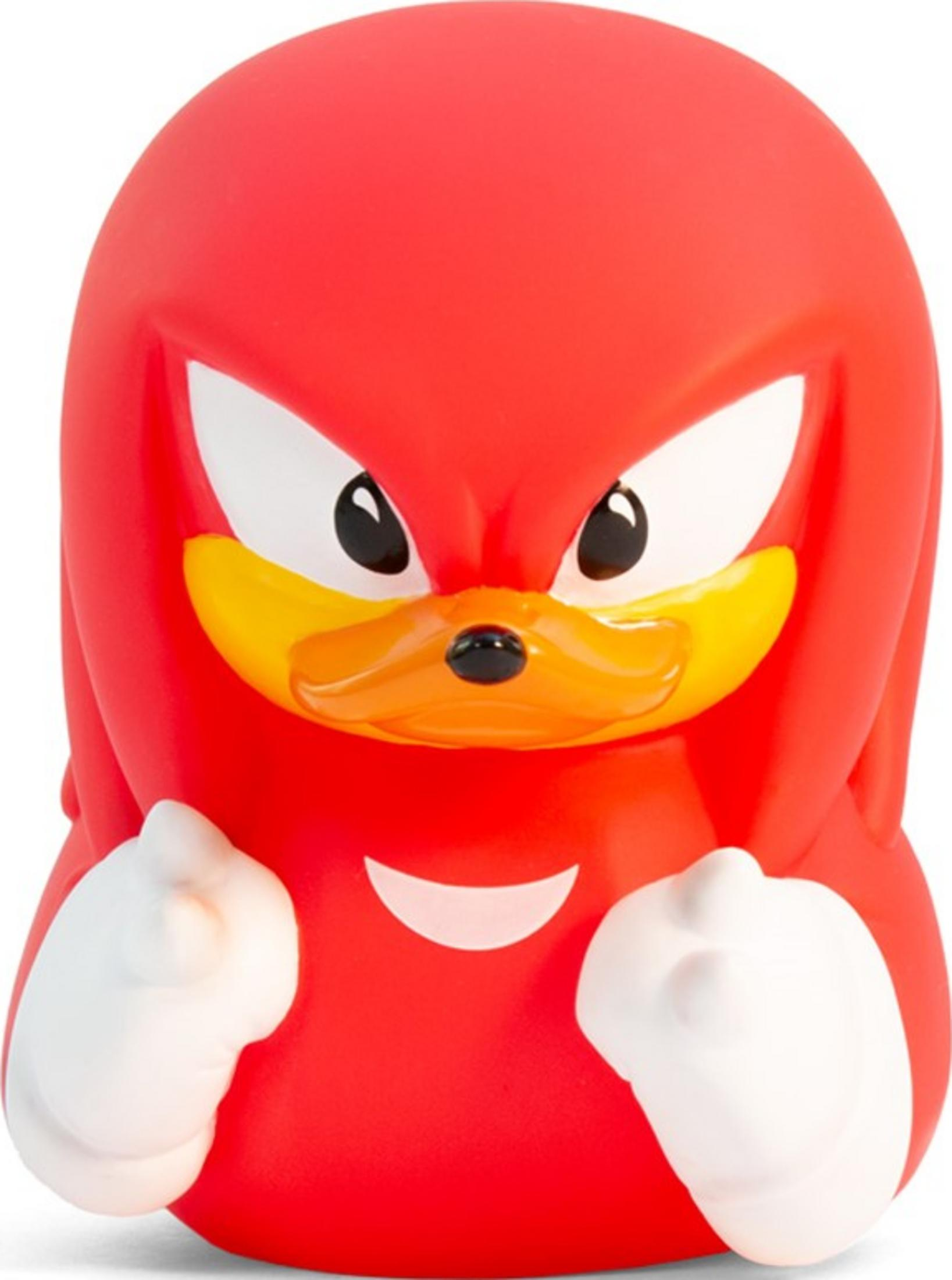 Eine rote Figur mit gelben Akzenten, weißen Fäusten und schwarzen Augen.