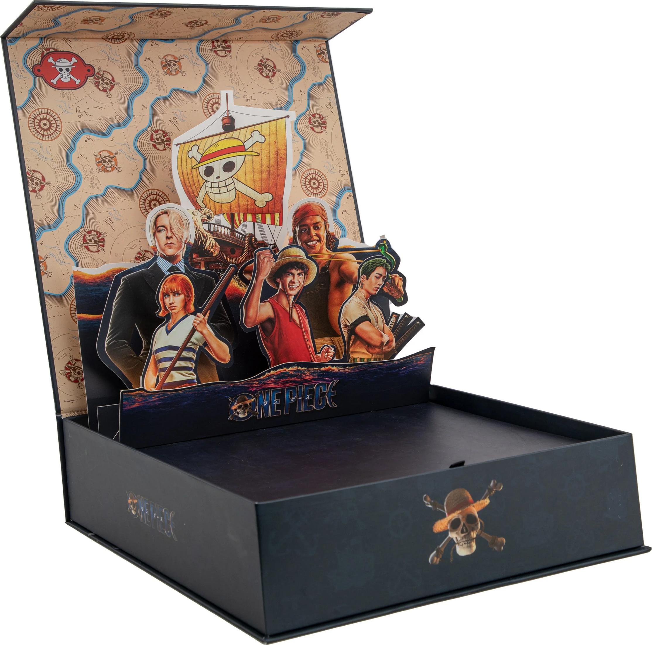 Pop-up-Box mit One Piece-Charakteren, Piratenkarte und Totenkopf-Symbolen.