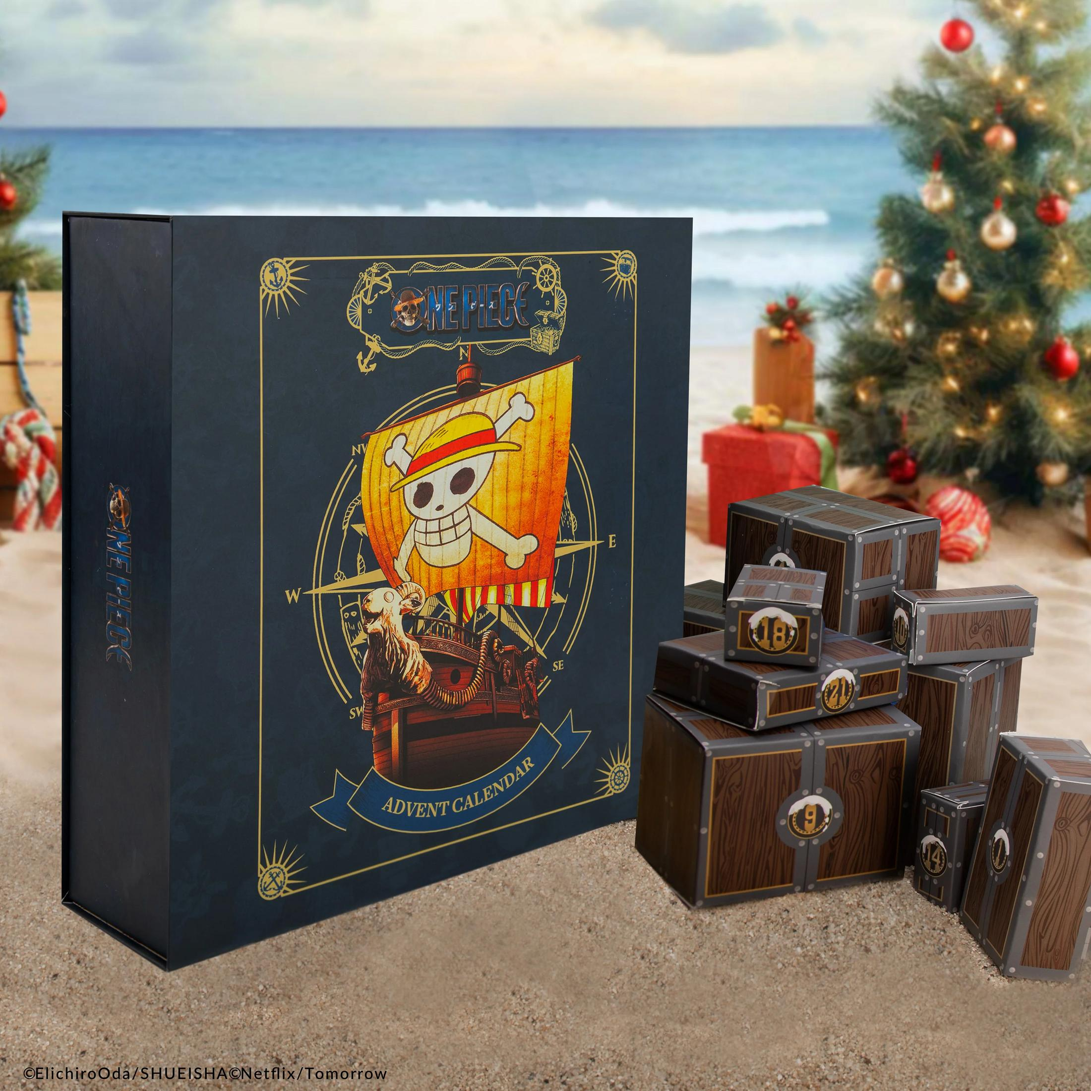 Ein One Piece Adventskalender auf einem Strand mit einem Weihnachtsbaum und Geschenken.