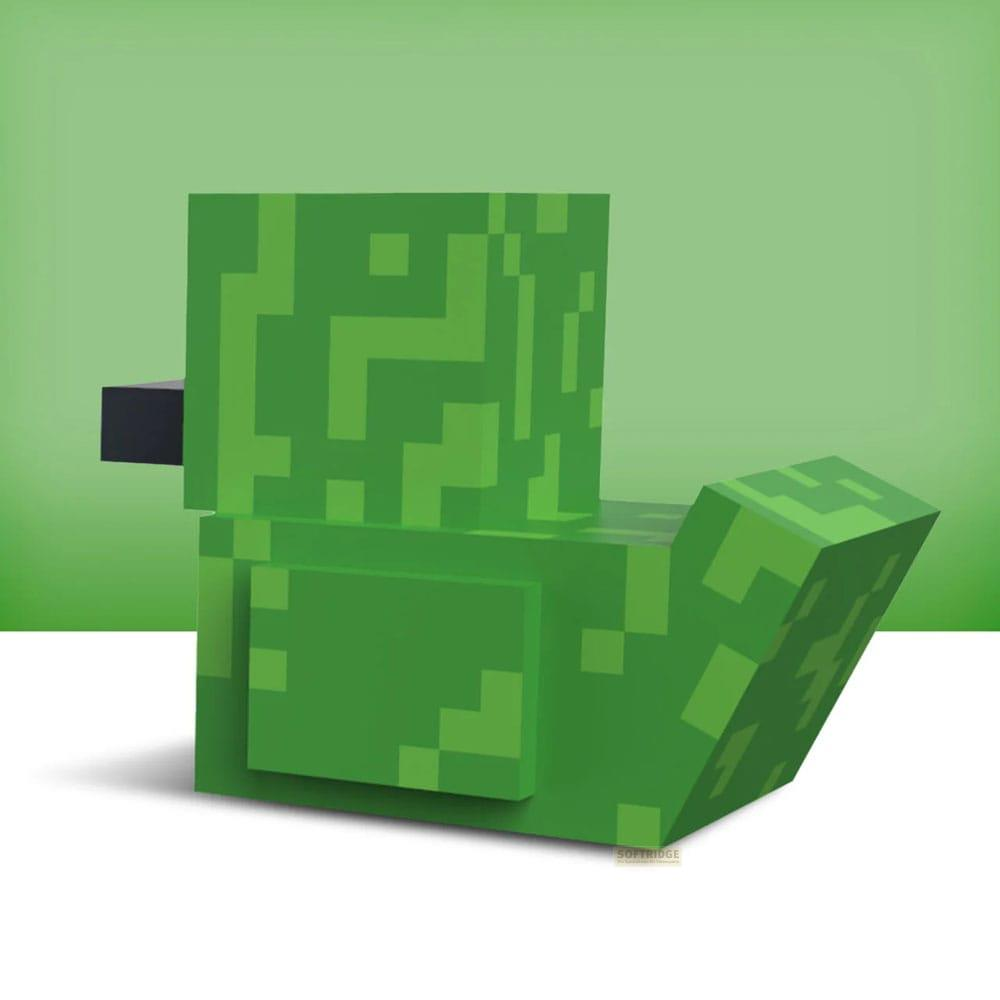 Ein grüner Pixel-Charakter, der einen Wassermelonenscheibe ähnelt, sitzt auf einem weißen Untergrund.