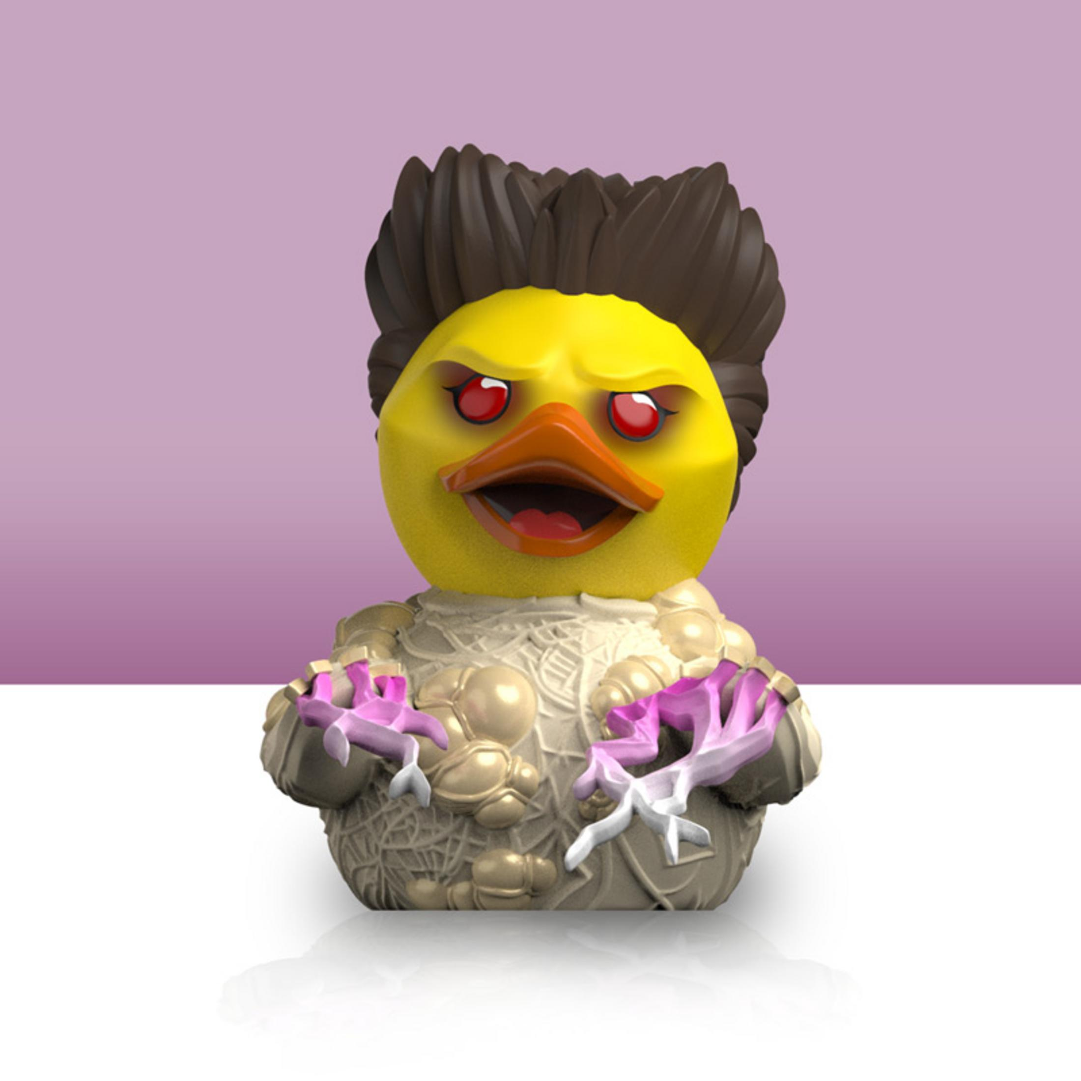 Eine gelbe Gummi-Ente mit braunem Haar, roten Augen und einem ausgebreiteten Mund.