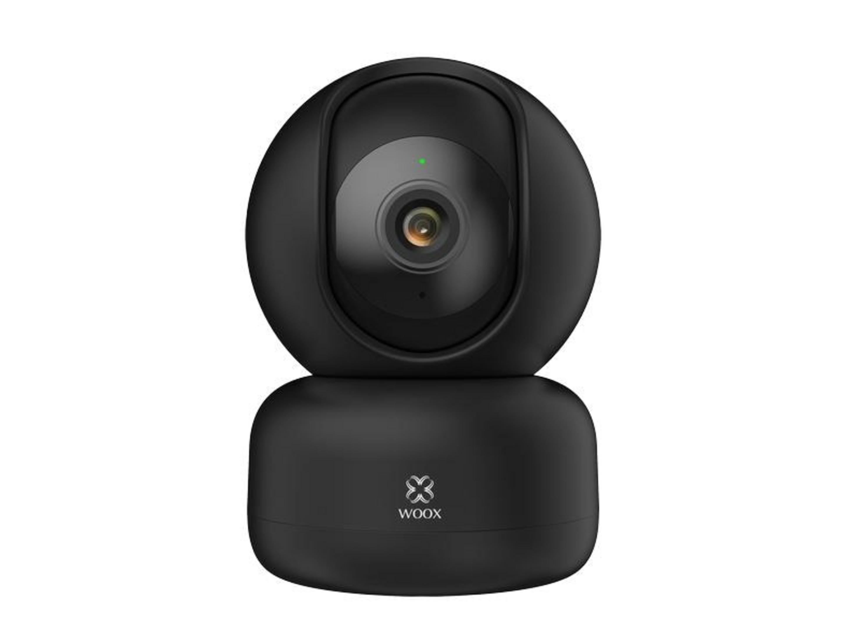 Una telecamera di sicurezza nera con obiettivo e spia verde.