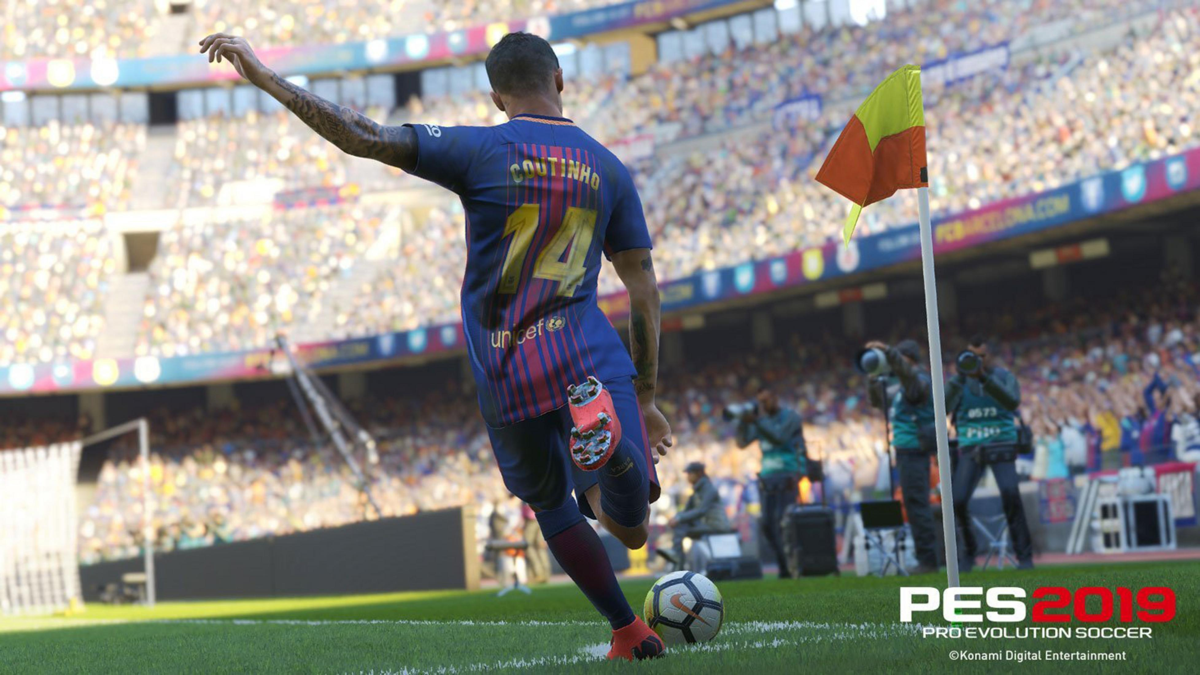 Il calciatore Coutinho in divisa blu e rossa calcia il pallone in uno stadio.