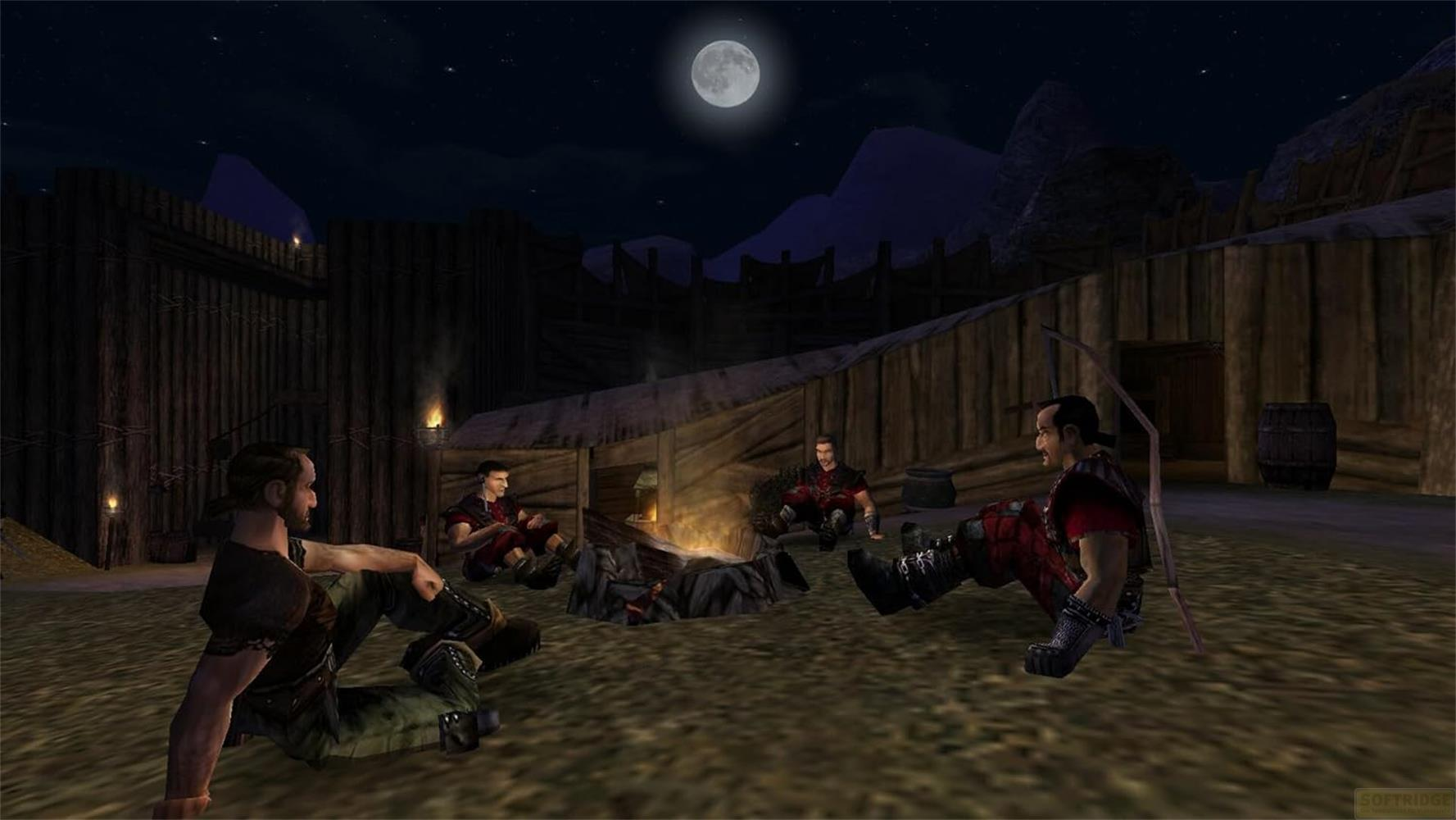 Des hommes assis autour d'un feu de camp la nuit devant des huttes en bois sous la lune.