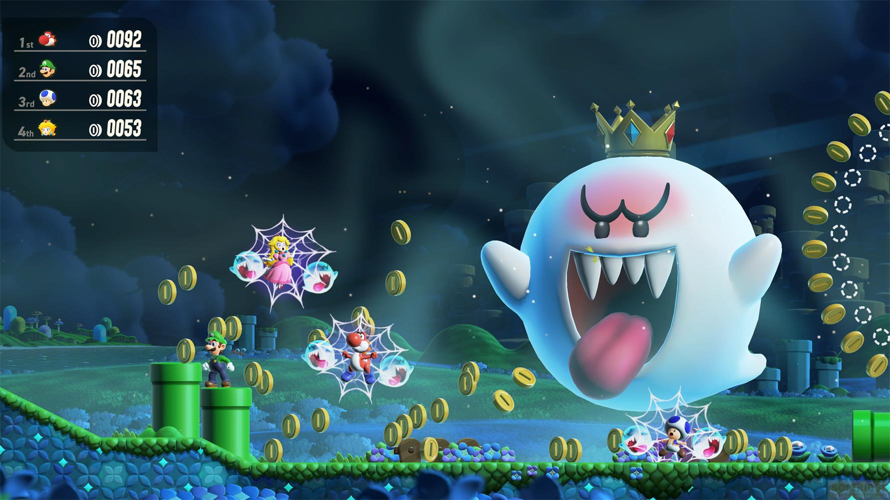 Luigi, Toad, Yoshi i Peach walczą z dużym Boo w nocnej scenerii.