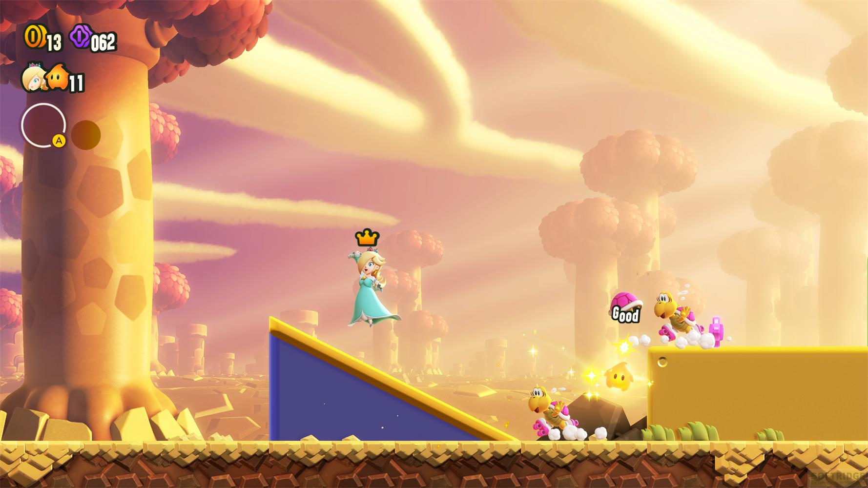 Rosalina unosi się na rampie, podczas gdy Koopy biegają po ziemi.