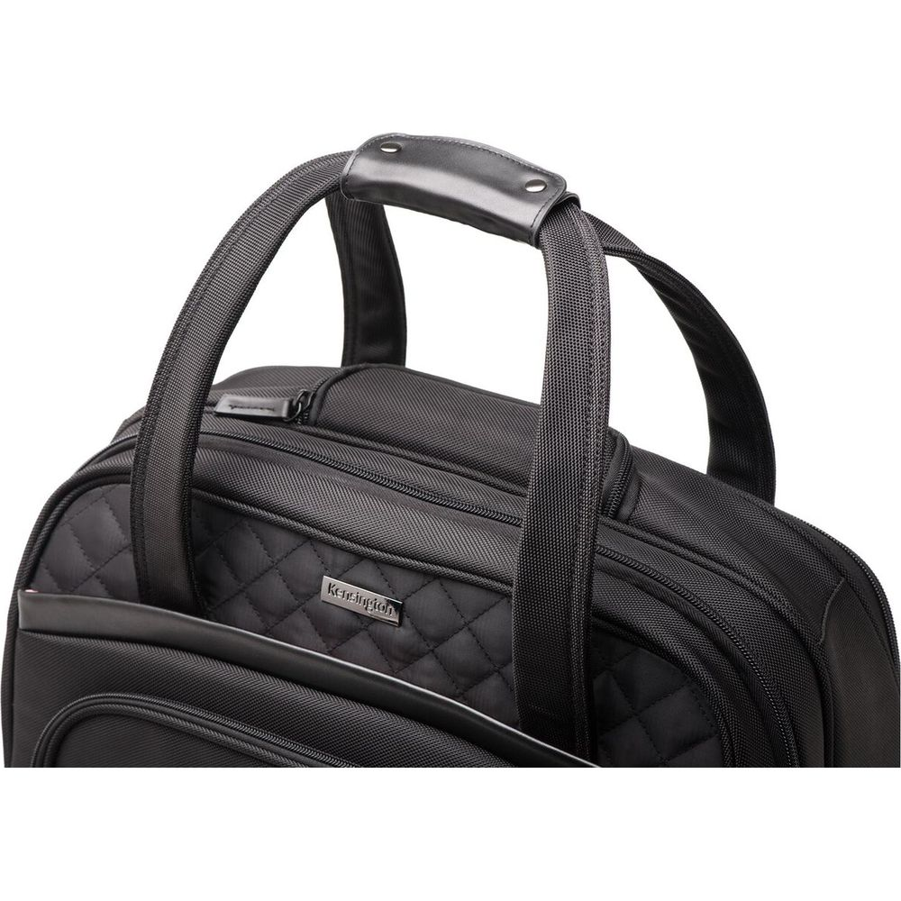 Schwarze Reisetasche mit gesteppten Akzenten und Ledergriff.