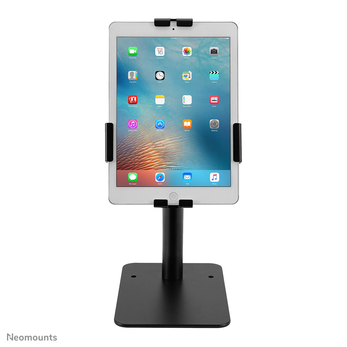 A black iPad stand holding a vertical iPad displaying its home screen interface.
