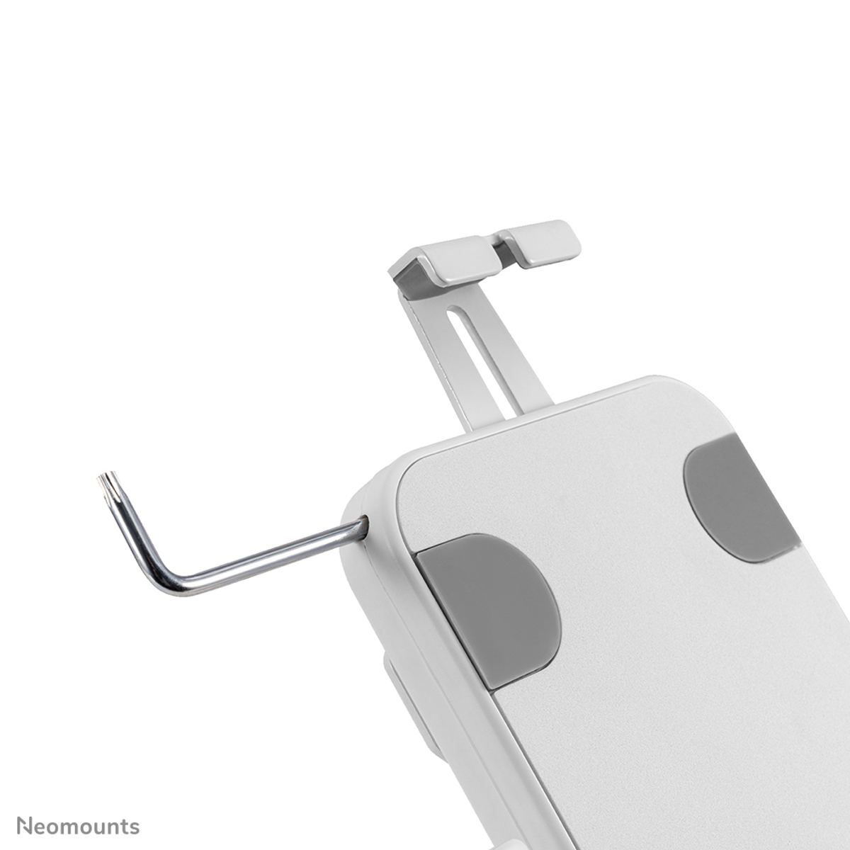 Un support de téléphone portable blanc avec une clé Allen en L dépassant sur le côté.