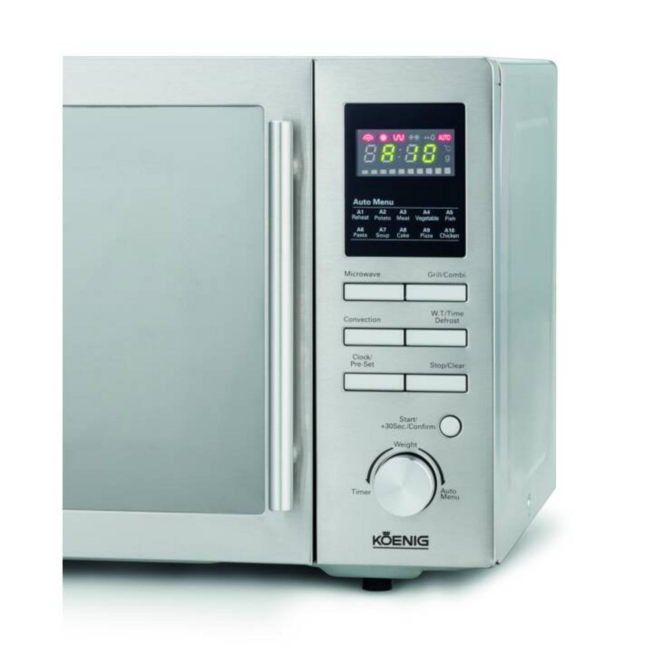 Micro-ondes en acier inoxydable avec écran numérique et panneau de commande. Comprend minuterie et sélection de menu.