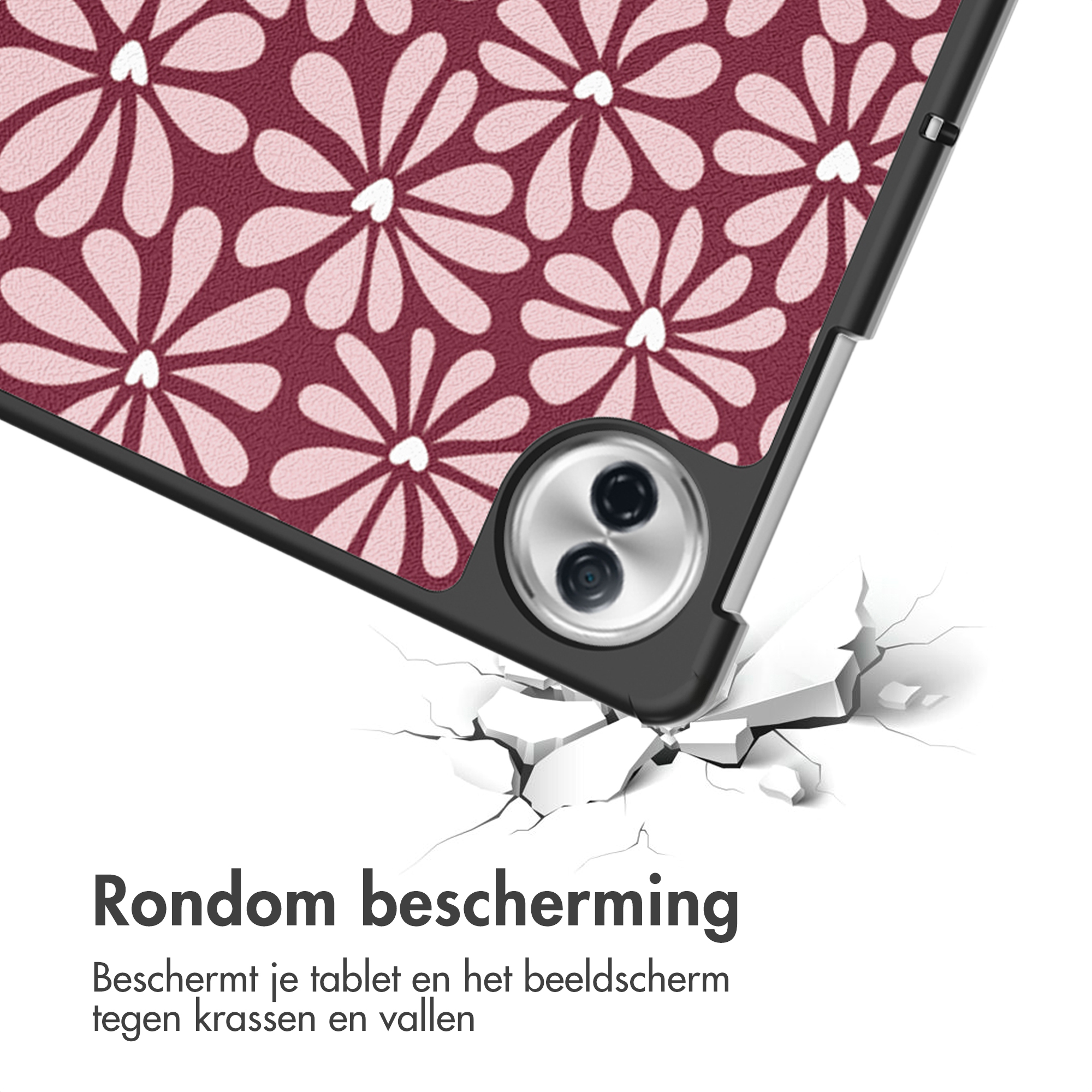 Une coque de tablette à motif floral tombe sur un sol craquelé.