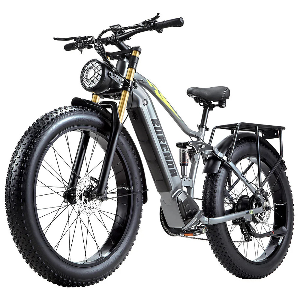 Bicicleta eléctrica gris con neumáticos anchos, suspensión y portaequipajes.
