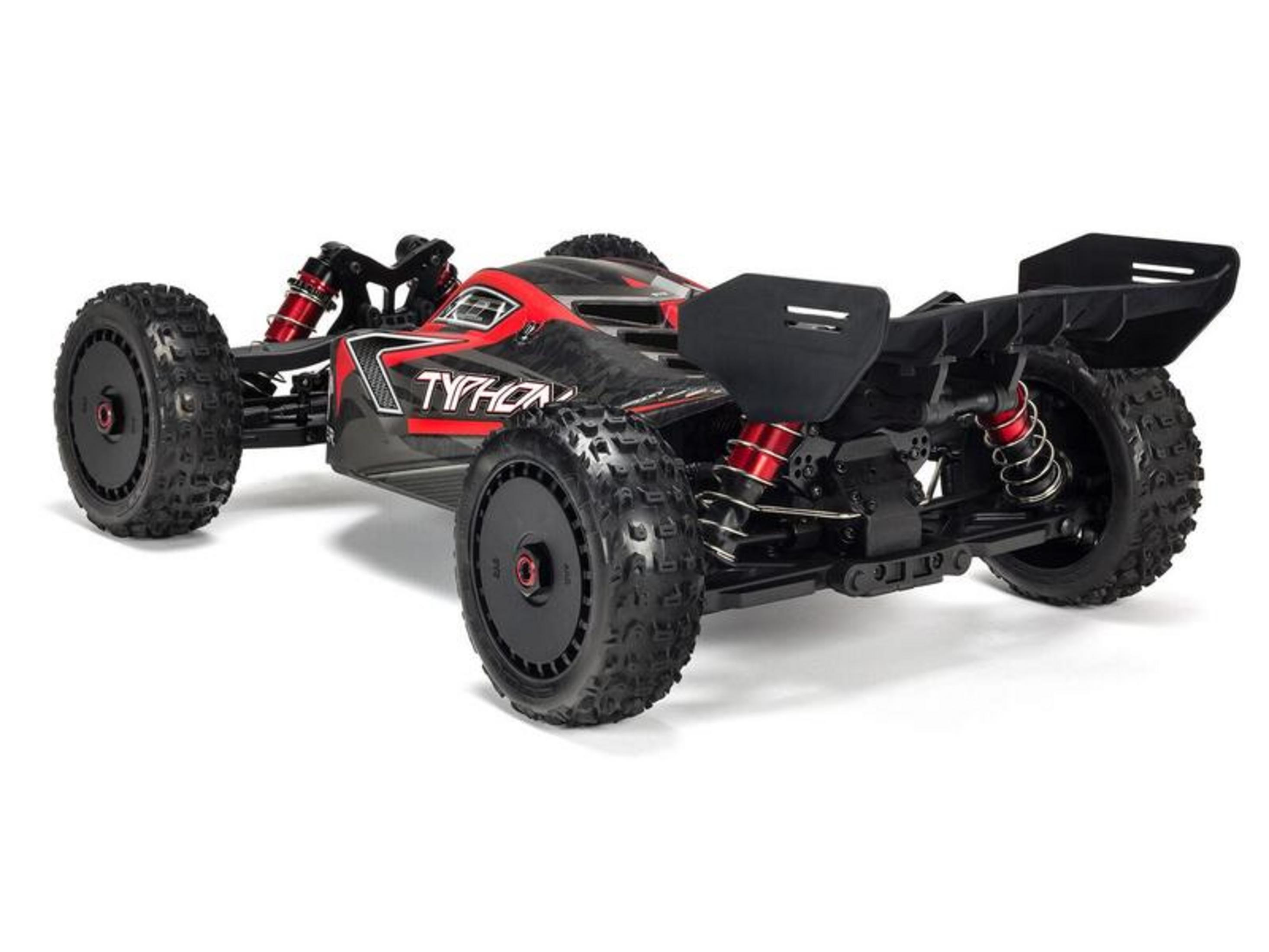 Ein schwarzer und roter ferngesteuerter Buggy mit großen Reifen und einem Heckflügel.