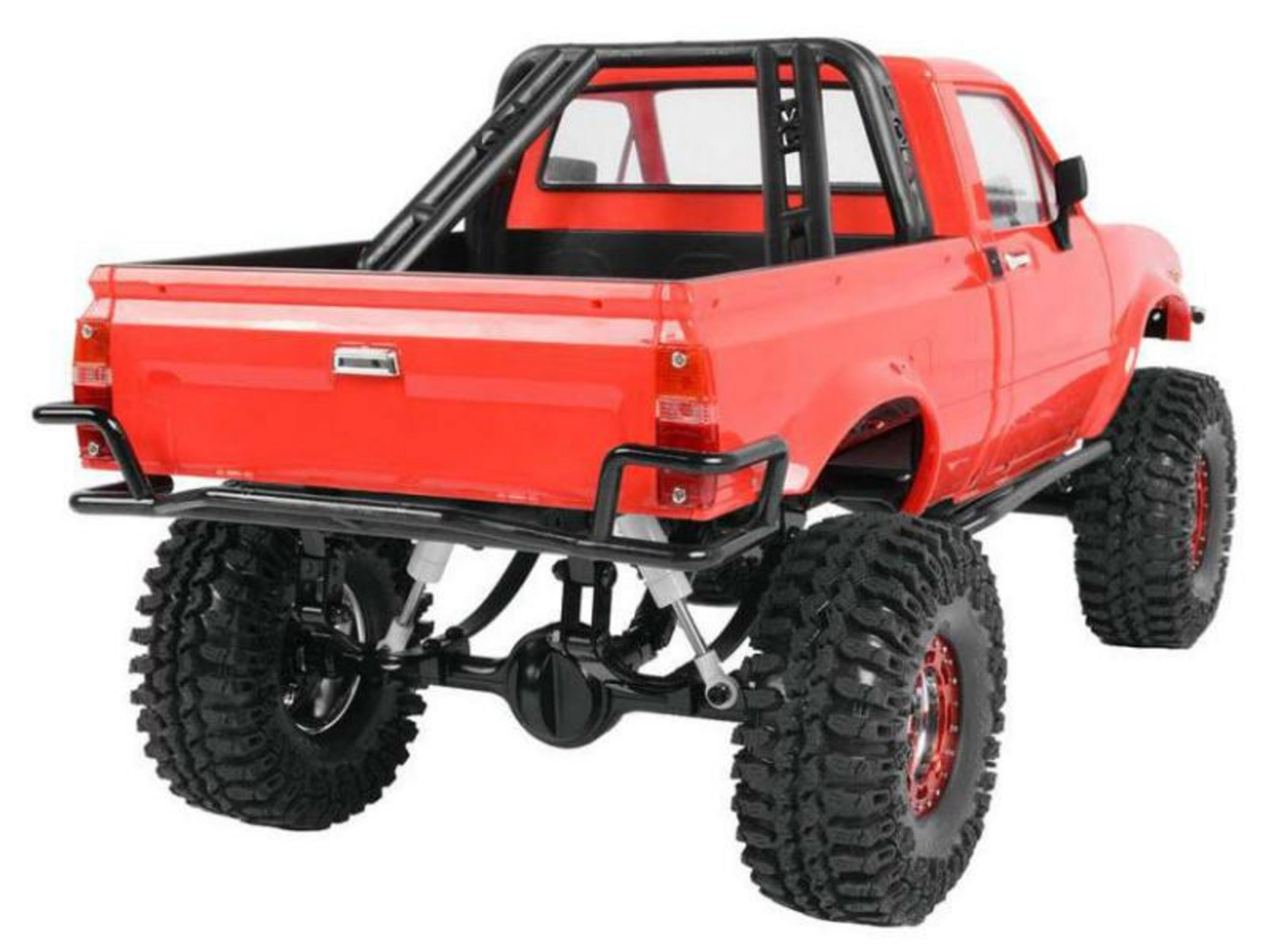 Camionnette monstre rouge télécommandée avec arceau noir et gros pneus tout-terrain.