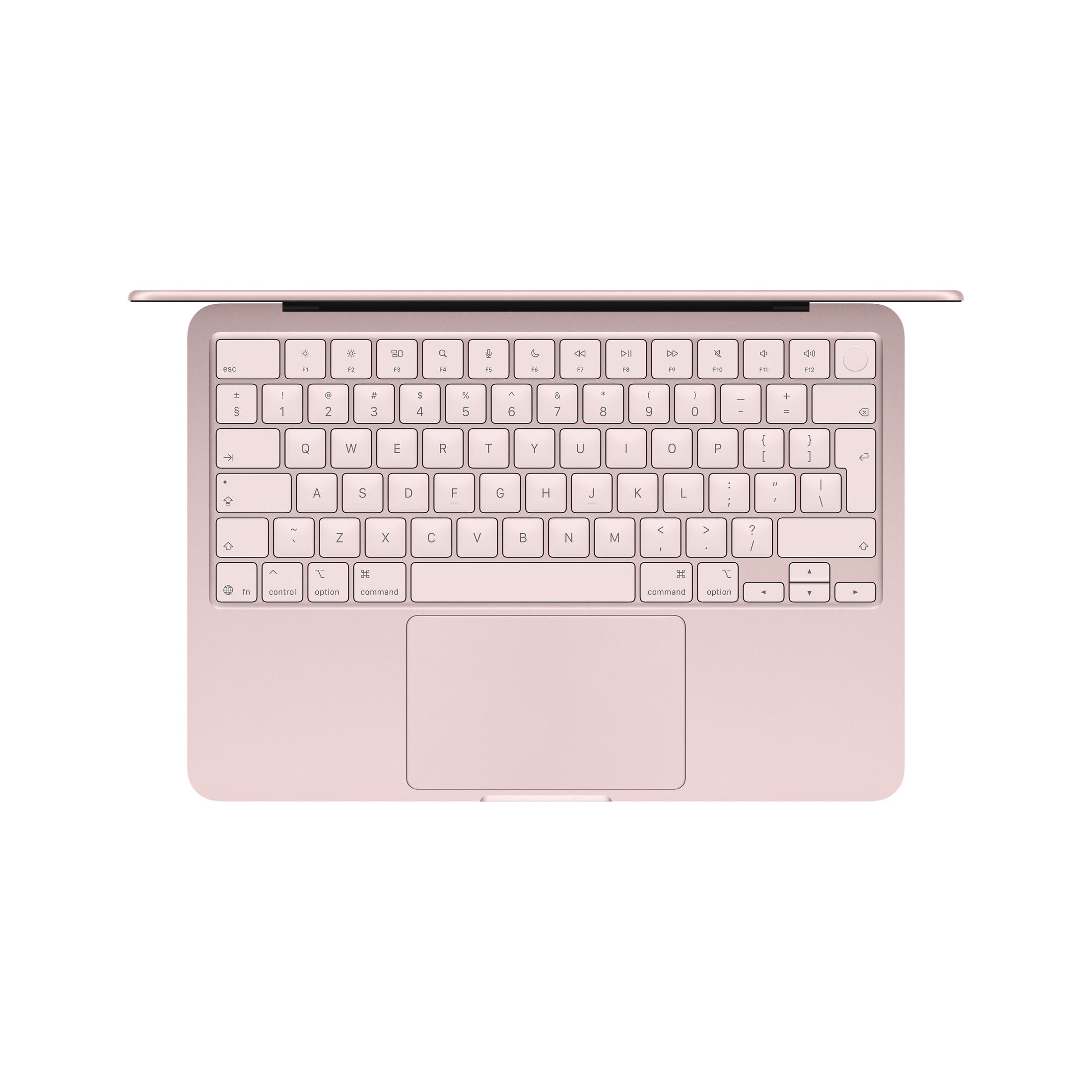 Un laptop MacBook Apple rosa, visto dall'alto, mostra tastiera e trackpad.