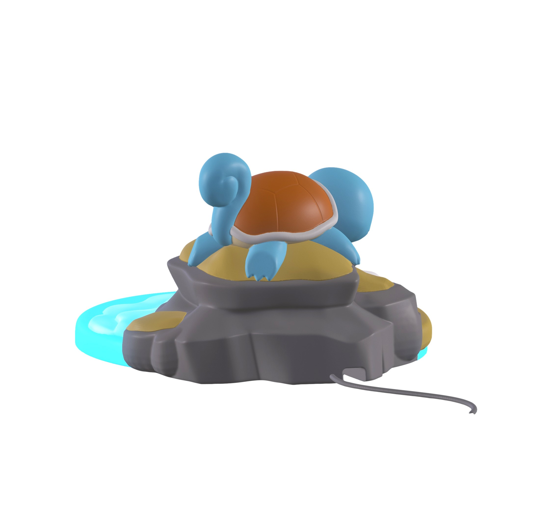 Eine blaue Schildkröte sitzt auf einem Felsen mit einem kleinen Wasserbereich.