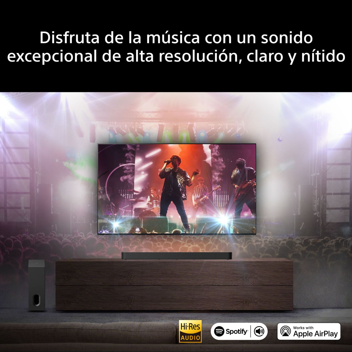 Una TV mostra una band sul palco. Sotto, un sistema audio e loghi.