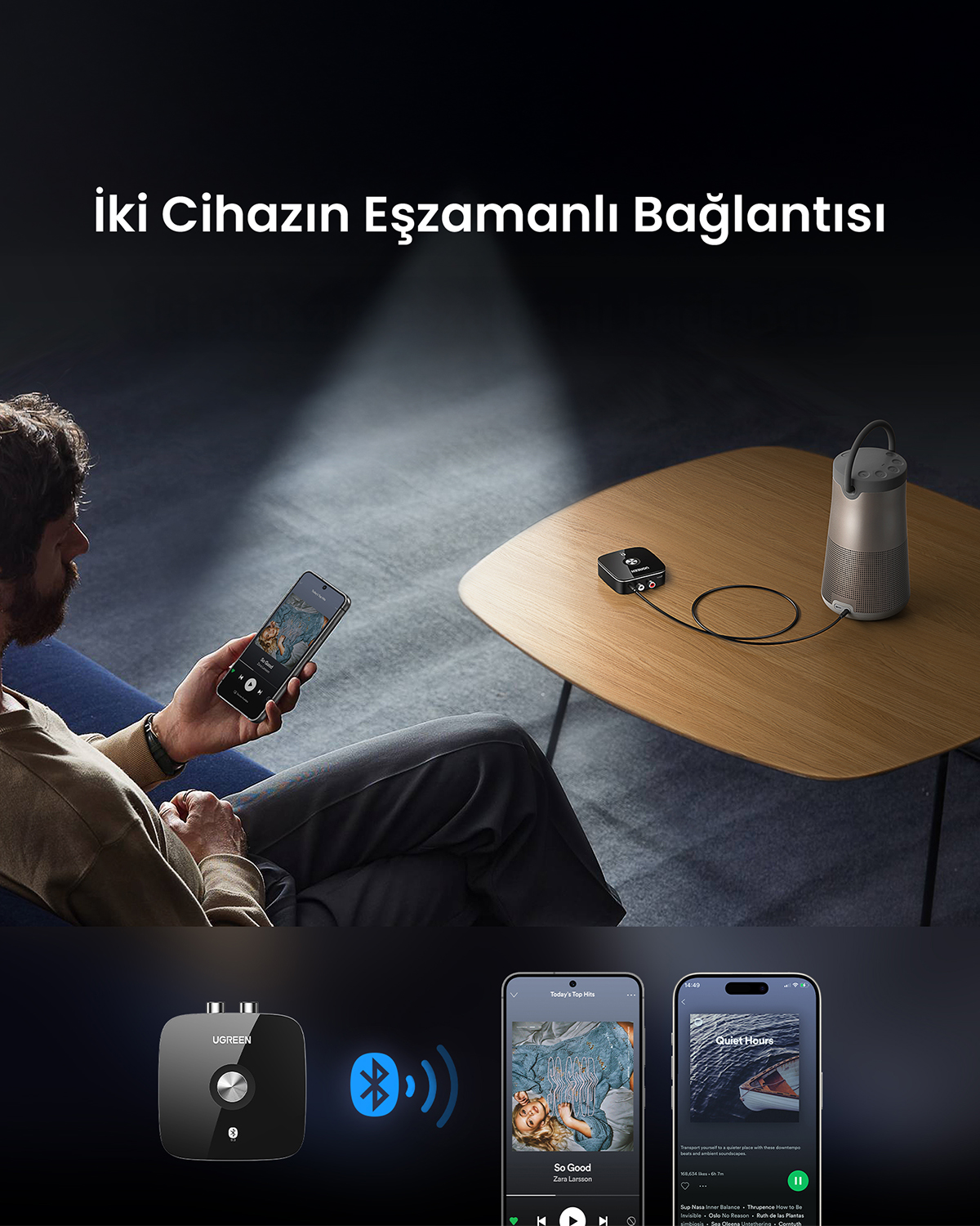 Erkek, ahşap masadaki hoparlöre Bluetooth ile telefon bağlıyor.