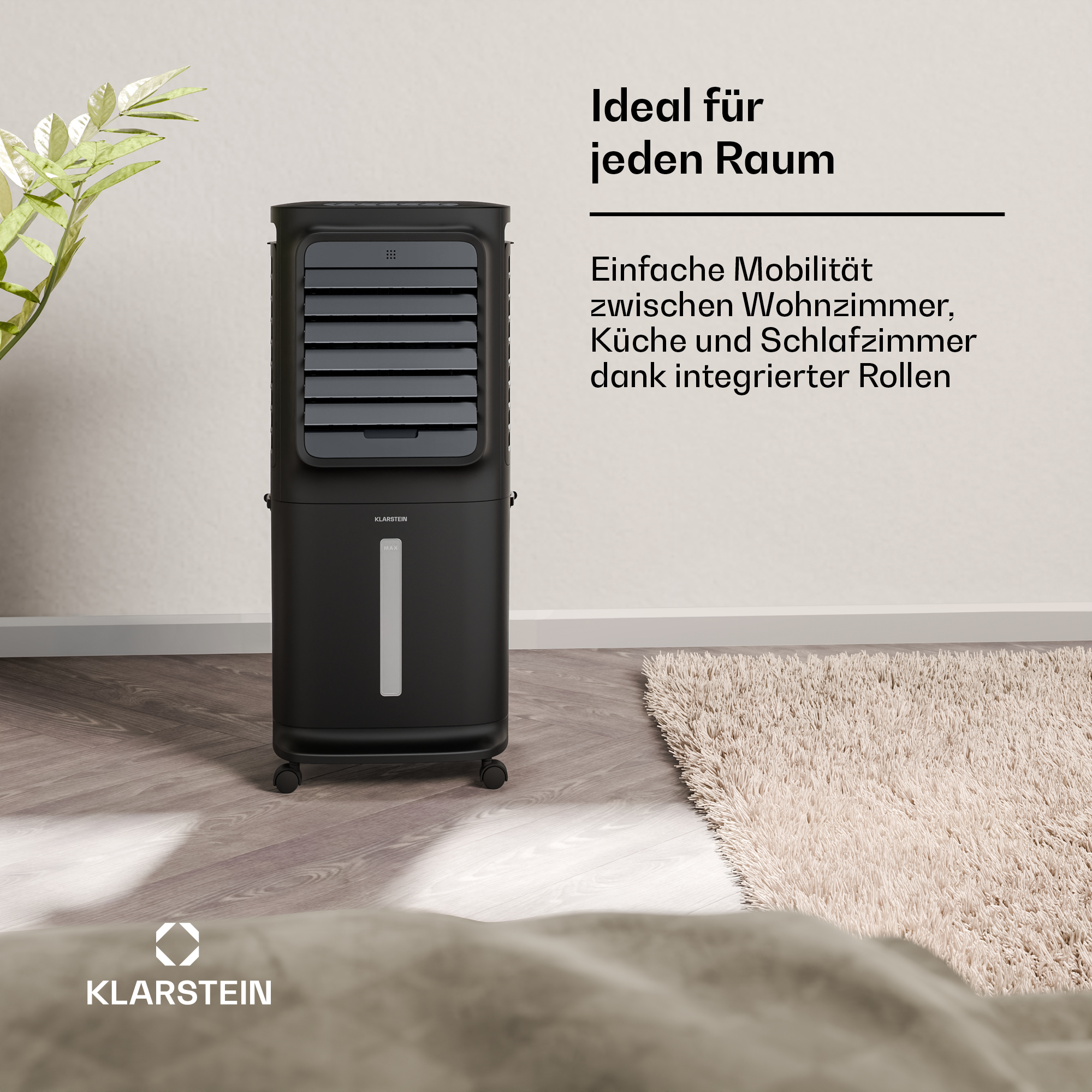 Schwarzer Luftkühler mit Rollen steht auf Holzboden neben Teppich.
