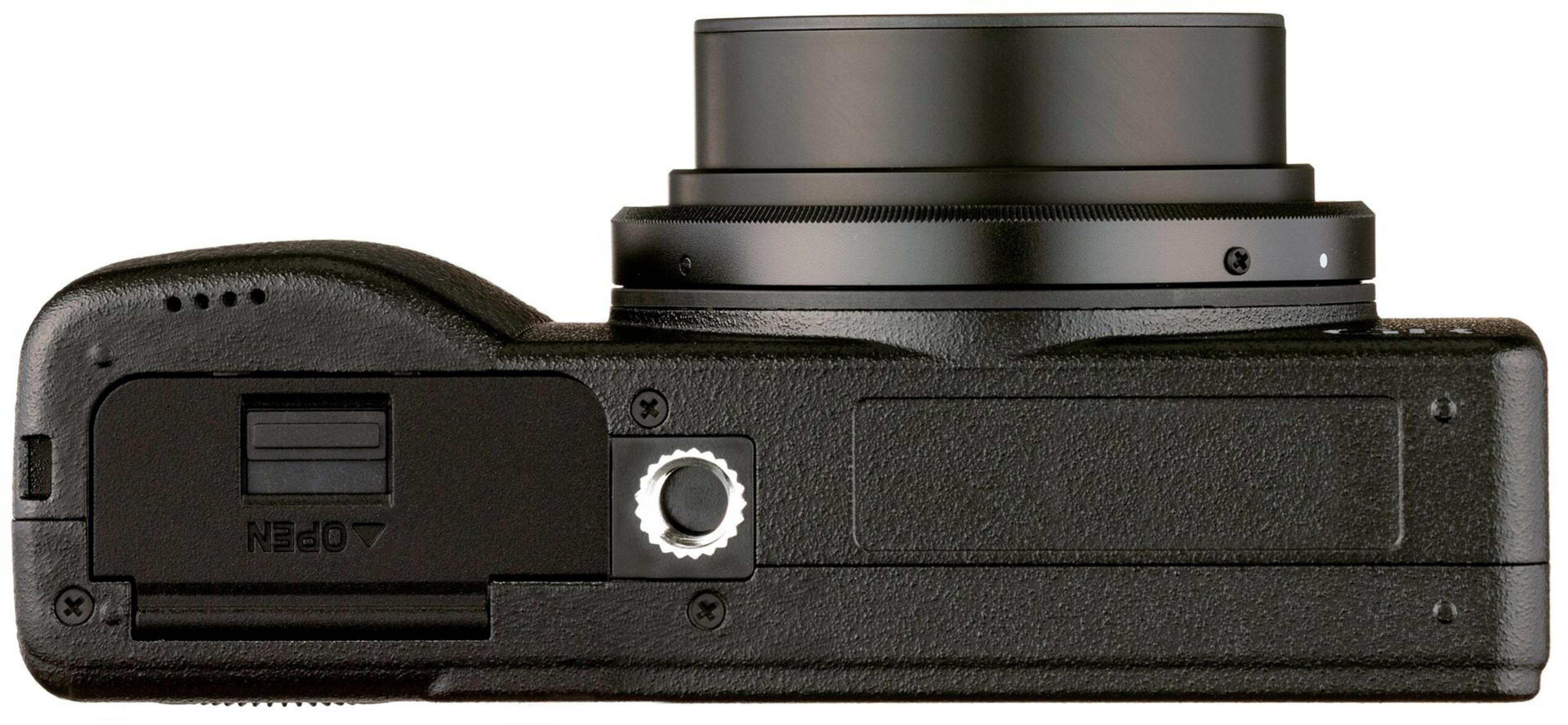 Primo piano di una fotocamera digitale nera, che mostra obiettivo e porte.