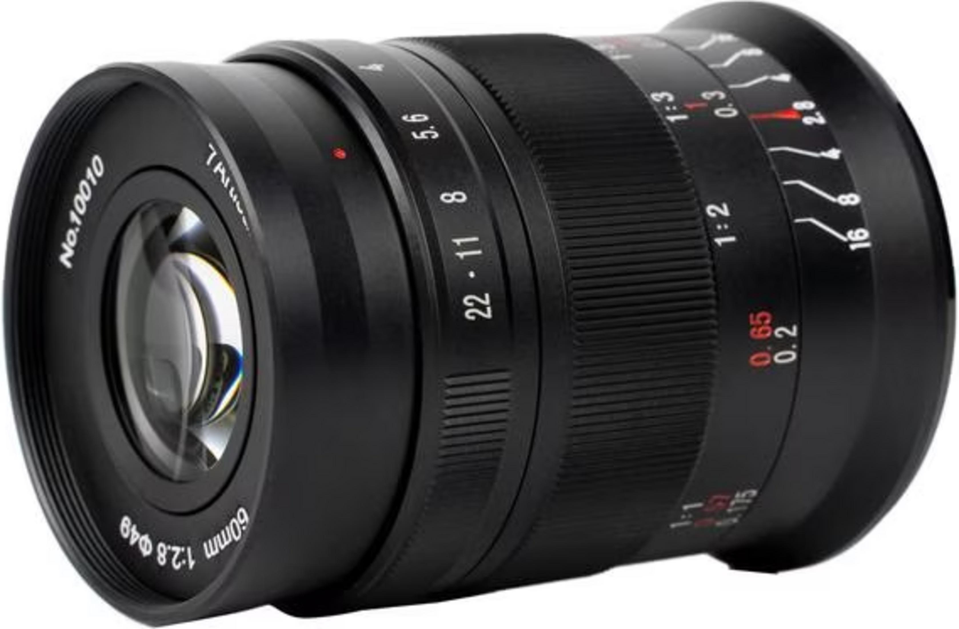 A camera lens with aperture markings (f/2.8-22) and focus distances (0.2m-infinity).