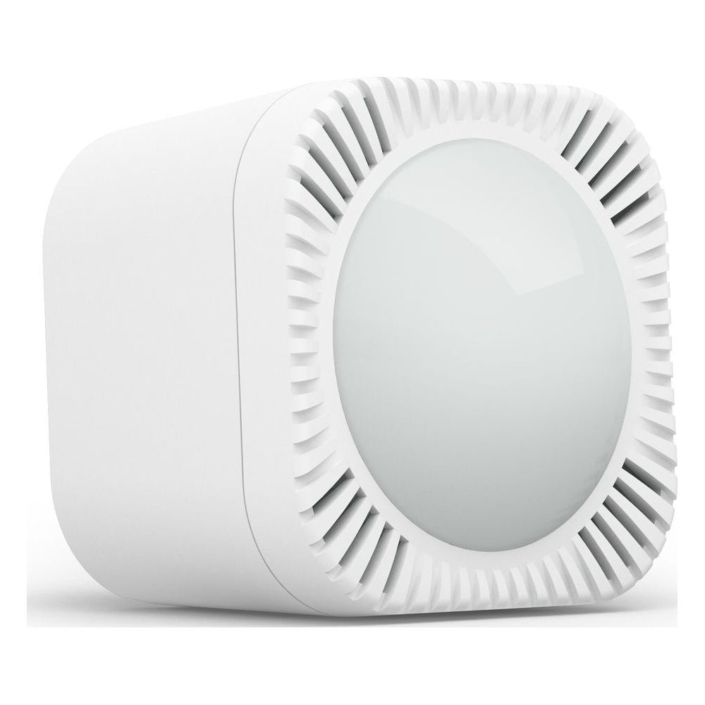 Un cubo bianco con un frontale rotondo e luminoso e fessure di ventilazione.