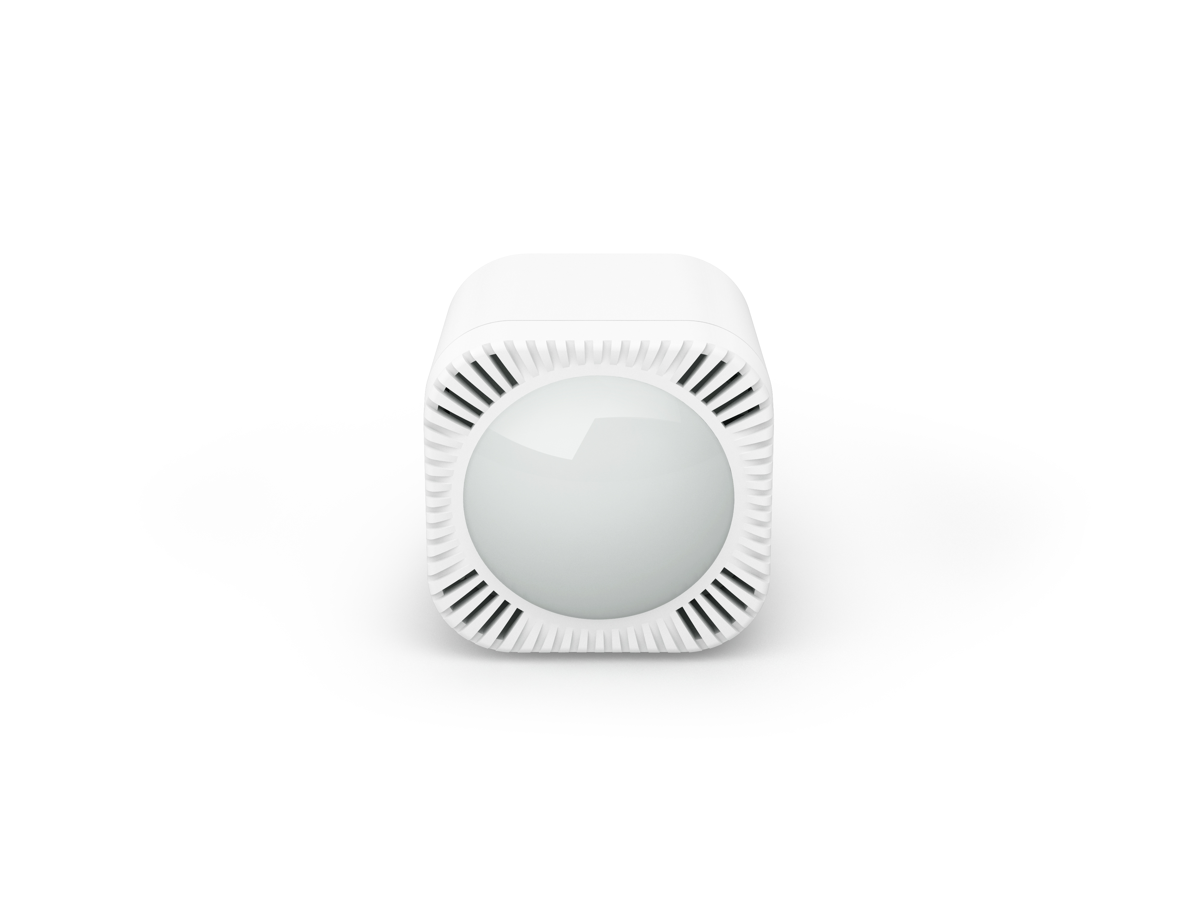 Un dispositivo bianco a forma di cubo con prese d'aria rotonde e una cupola centrale.
