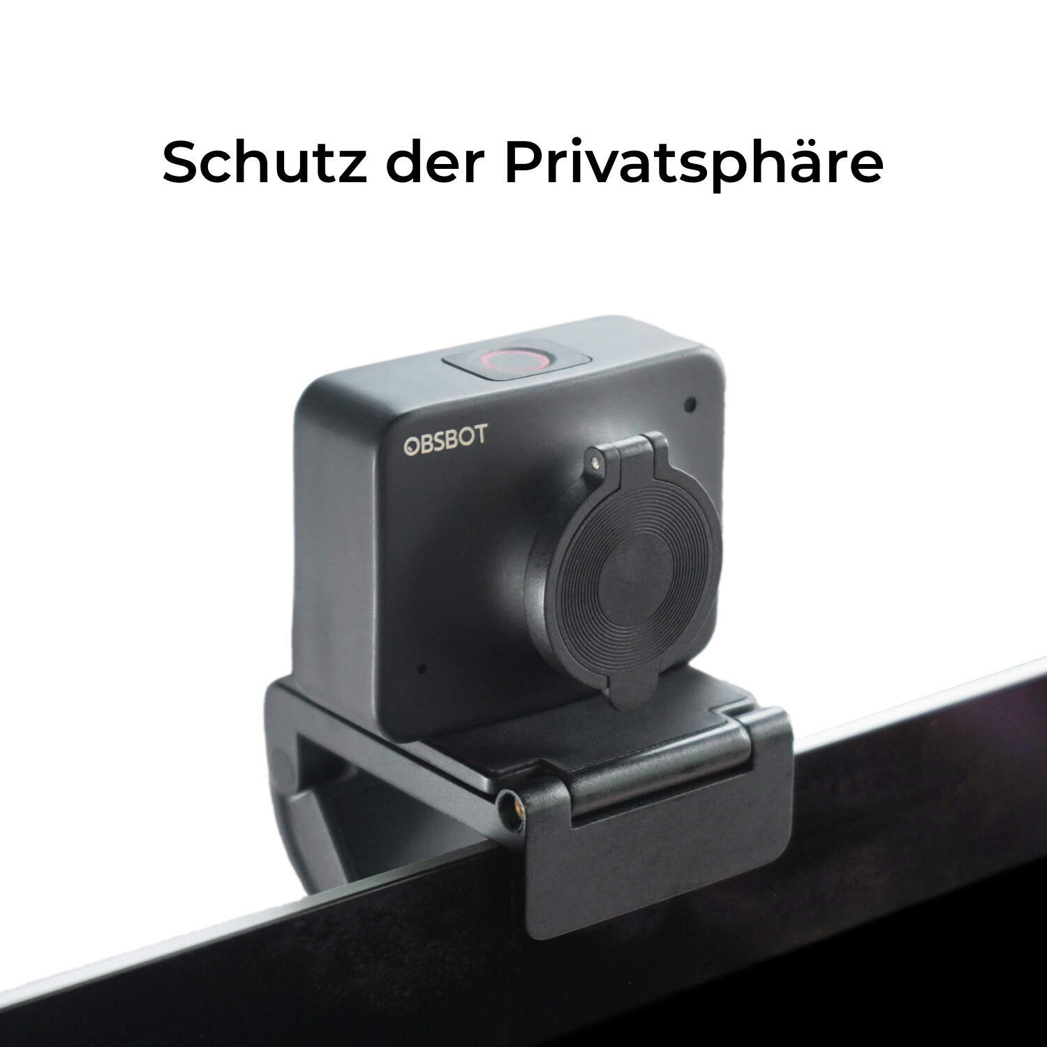 Una clip per webcam OBSBOT nera con copriobiettivo su un monitor.