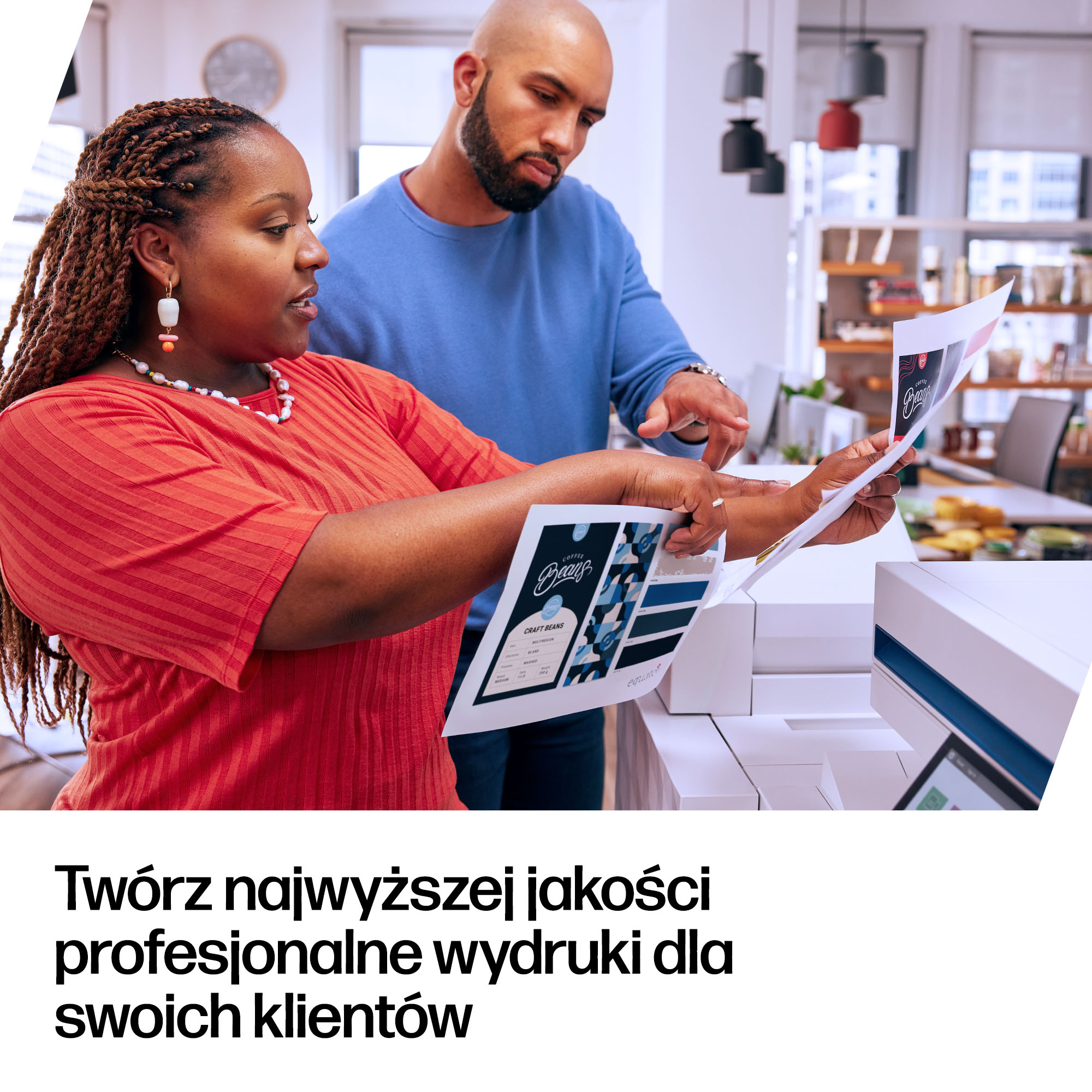 Two people examine a document with coffee branding. A man in blue, a woman in red. Office setting.
