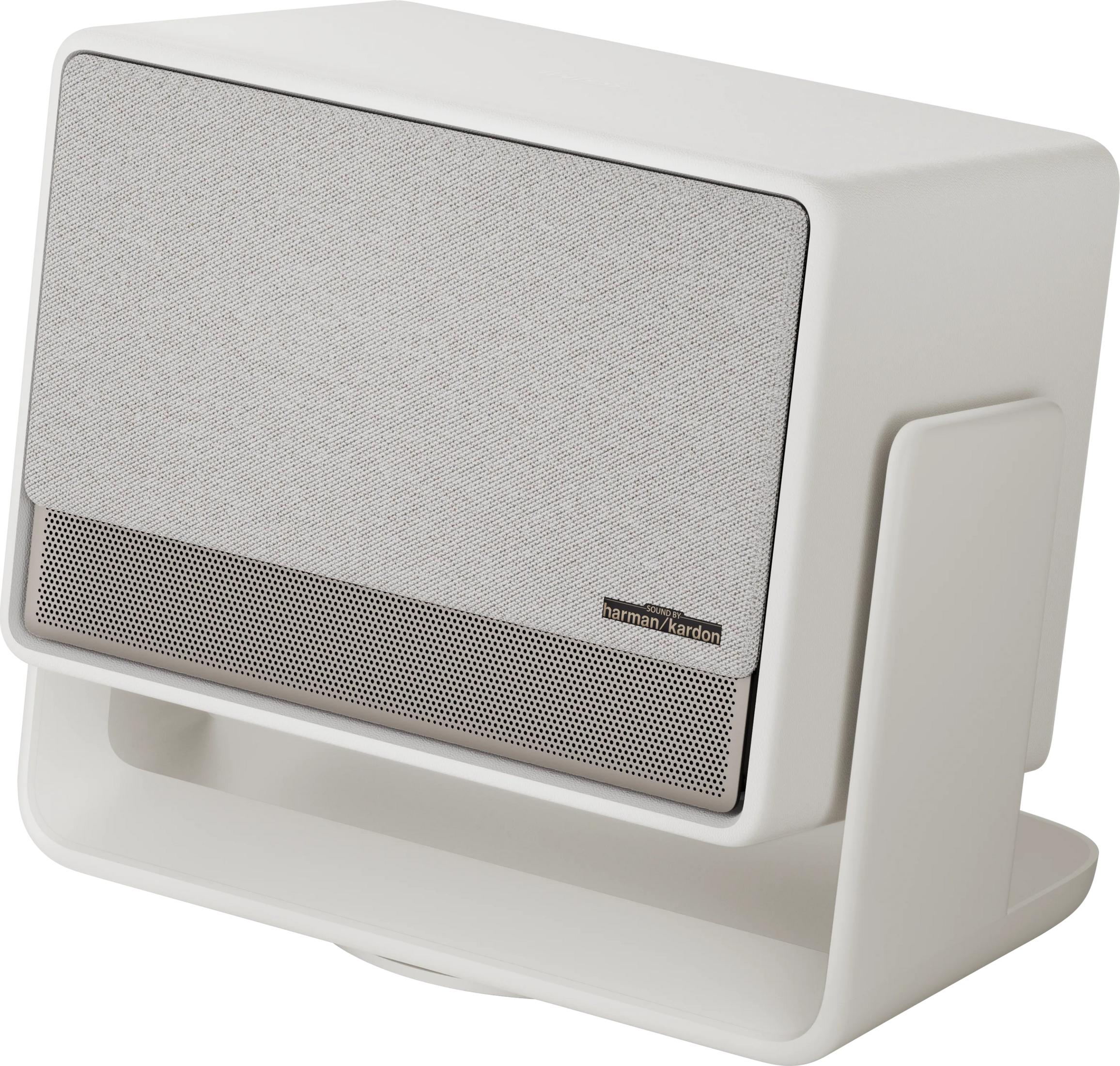 Enceinte blanche avec grille en tissu et logo Harman/Kardon sur un support.
