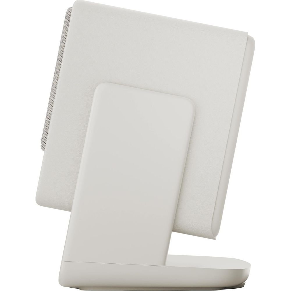 Un haut-parleur blanc avec grille en tissu et support, vu de côté.