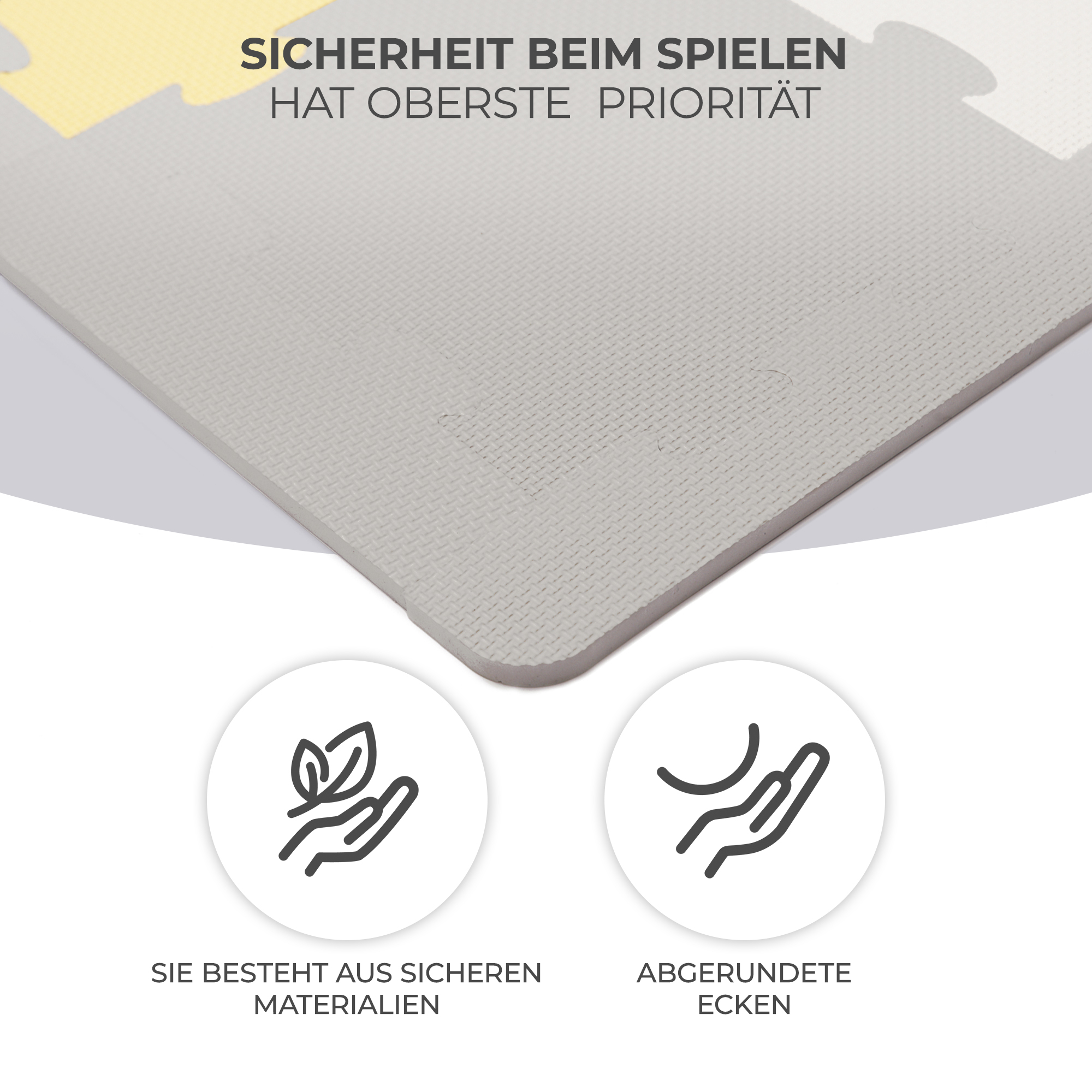 Graue Puzzlematte mit gelben Akzenten, Icons für sichere Materialien und abgerundete Ecken.