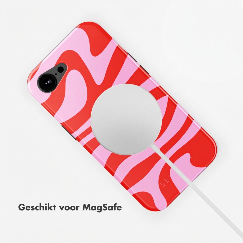 Coque de téléphone rouge et rose avec chargeur MagSafe et câble.