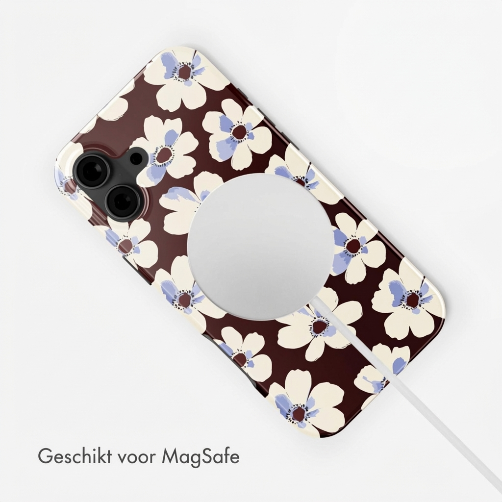 Custodia per telefono marrone con motivo floreale bianco-blu e cerchio MagSafe.