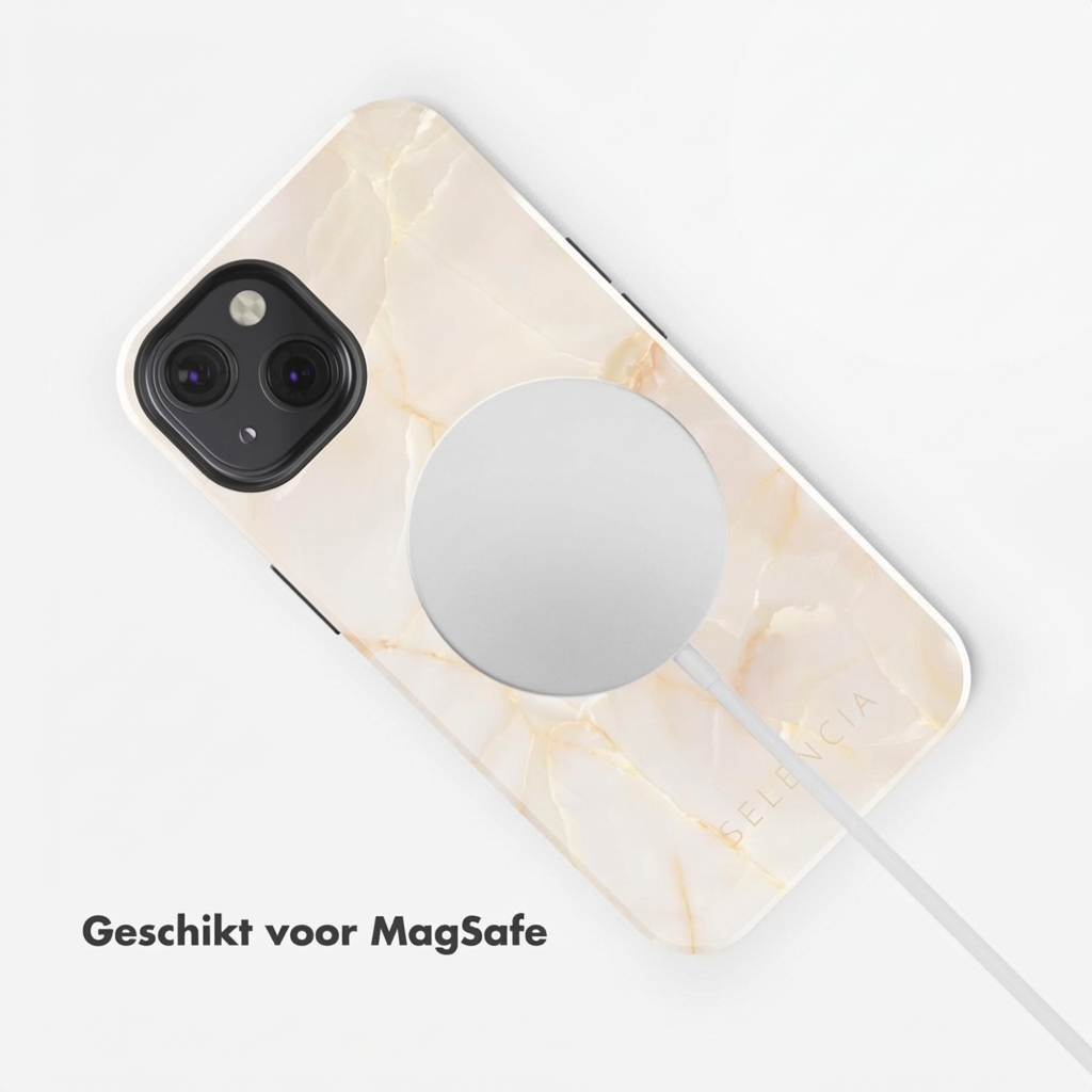 Un iPhone con cover effetto marmo e caricatore MagSafe.