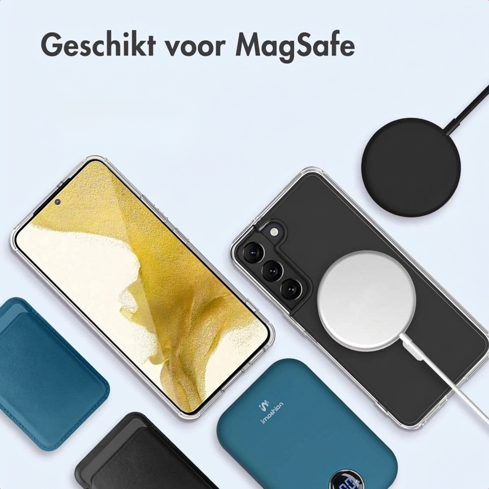 A smartphone with a case, wireless charger, and power bank on a light background.