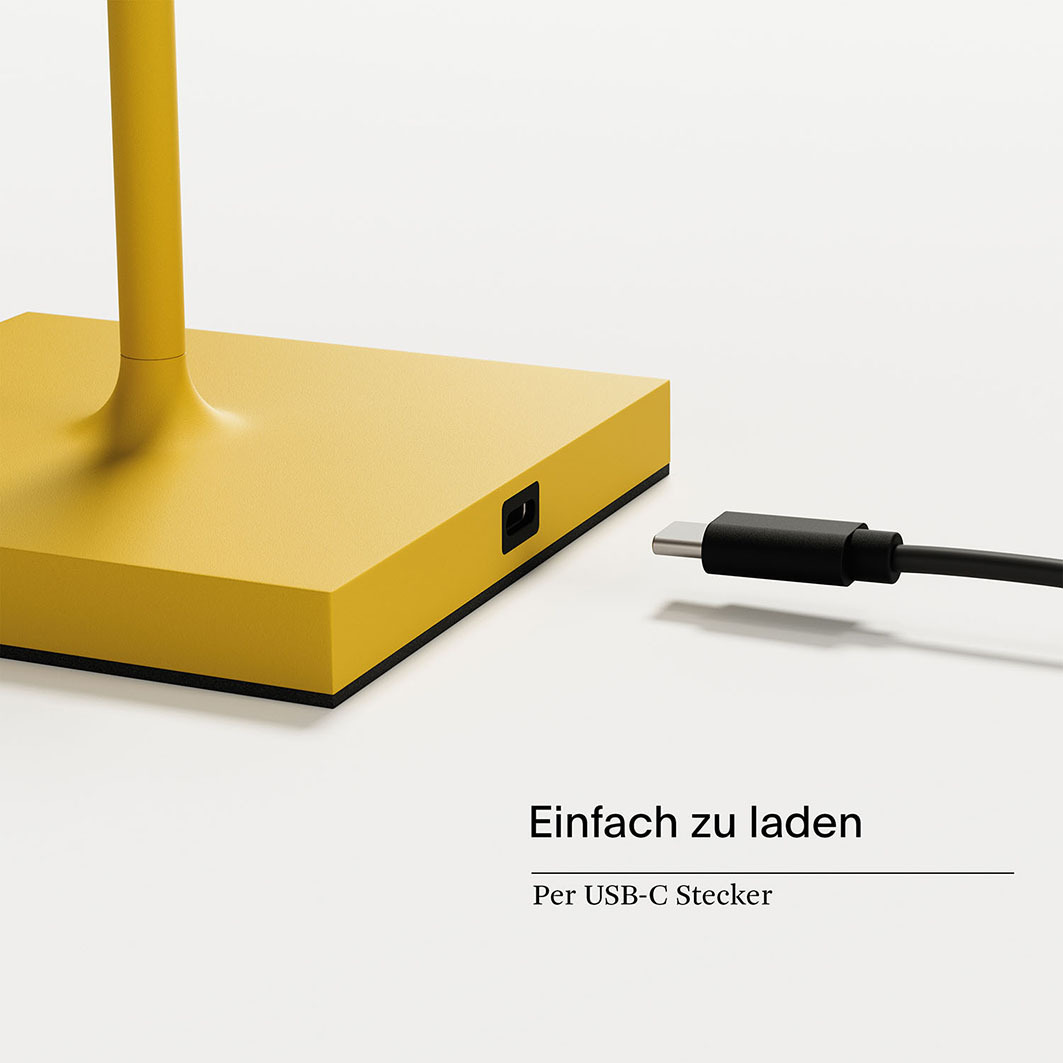 Gelbe Lampe mit USB-C-Anschluss und schwarzem Kabel.